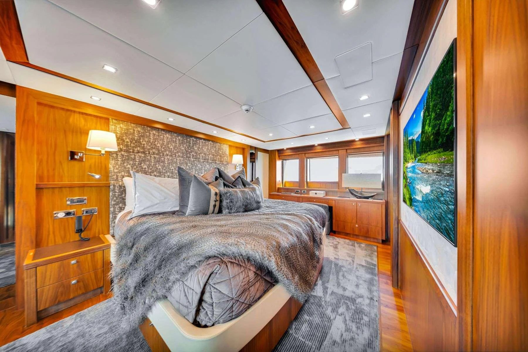 a bedroom with a large bed aboard NATURAL 9 Yacht for Charter