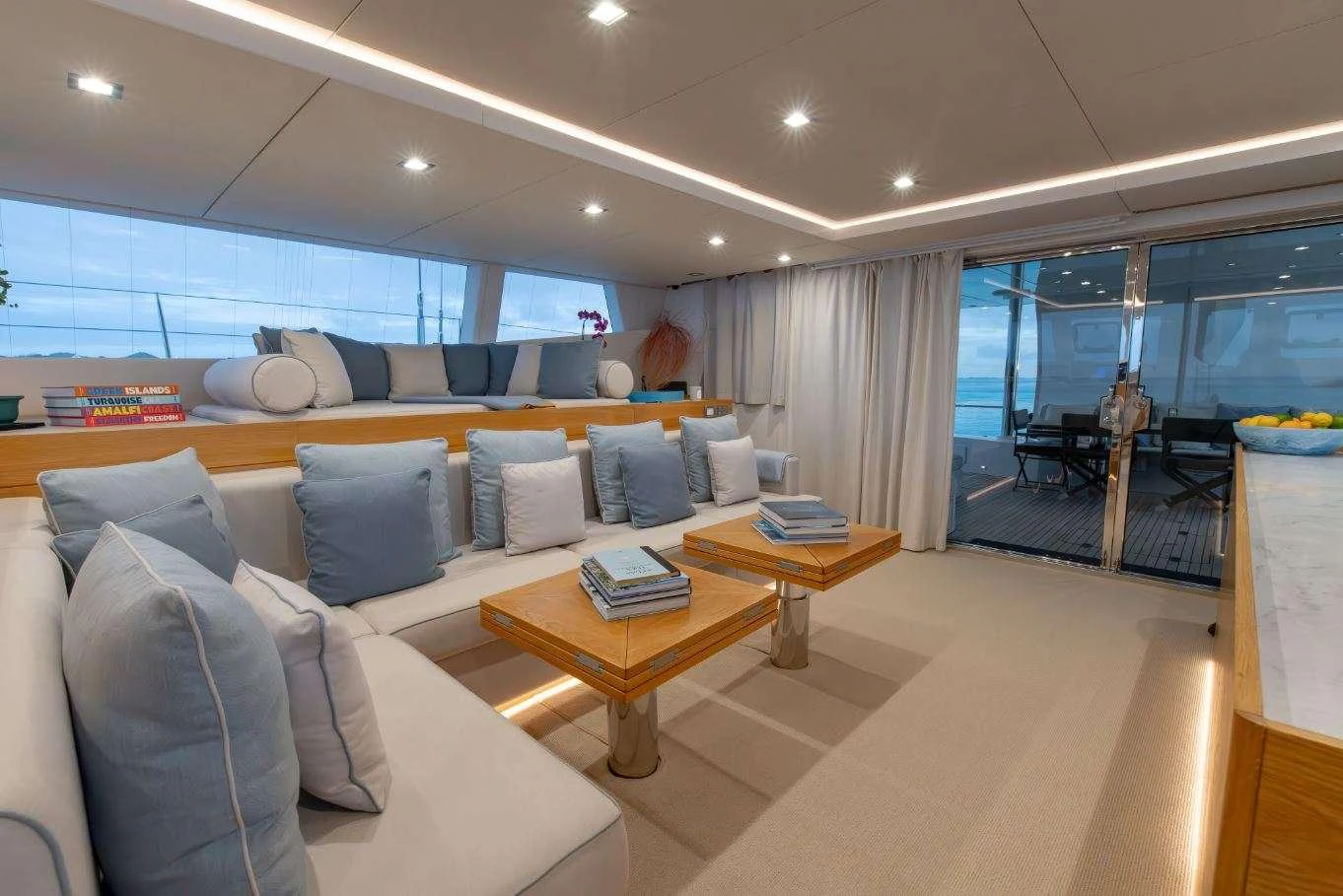 a living room with a couch and a table aboard DIANA Yacht for Charter