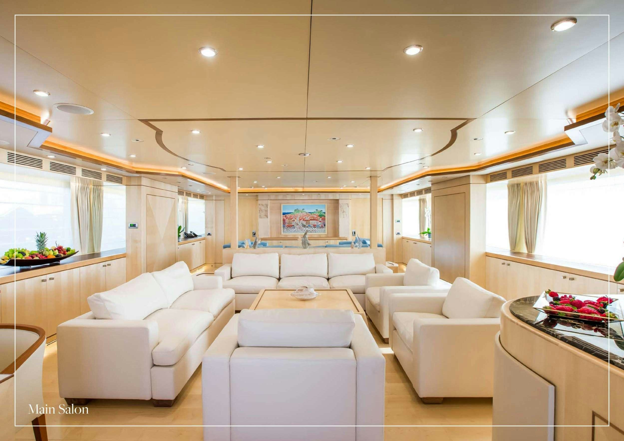a living room with white furniture aboard ARTHUR'S WAY Yacht for Charter