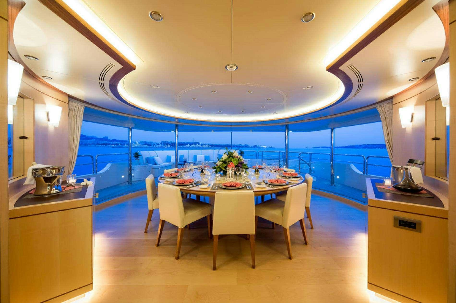 a large kitchen with a round table aboard ARTHUR'S WAY Yacht for Charter