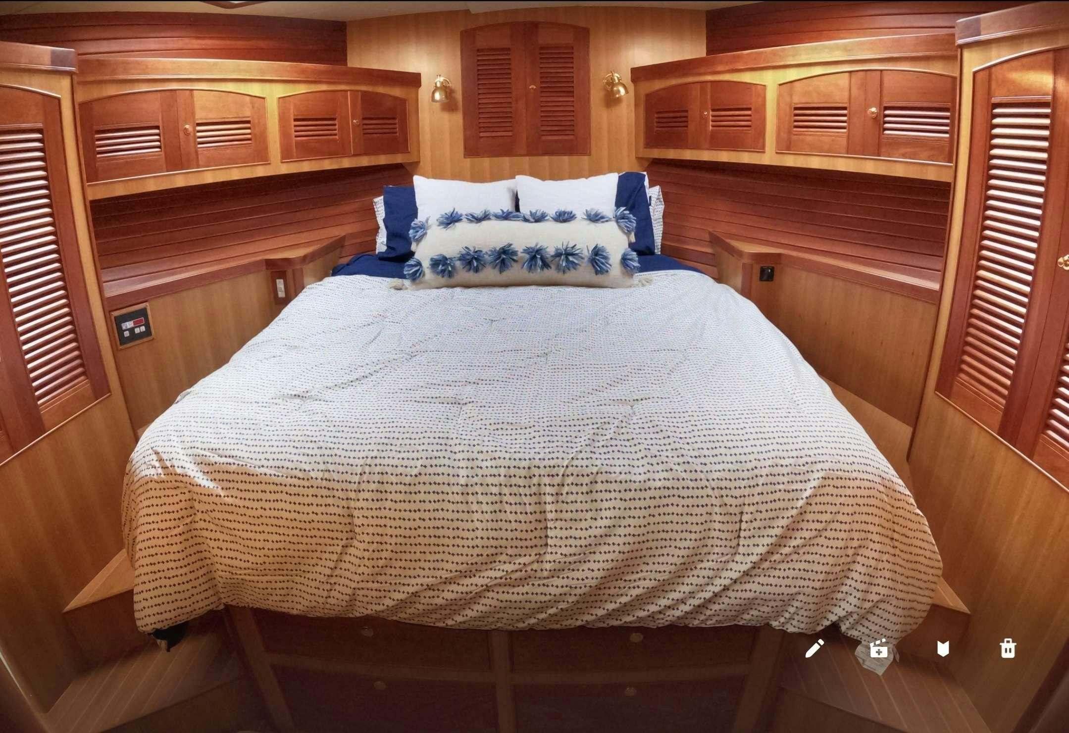 a bed in a cabin aboard WHAT'S NEXT Yacht for Charter
