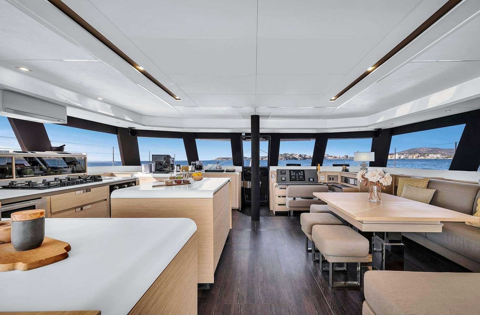 a room with a large window and a view of the city aboard ALEGRIA 67 Yacht for Charter