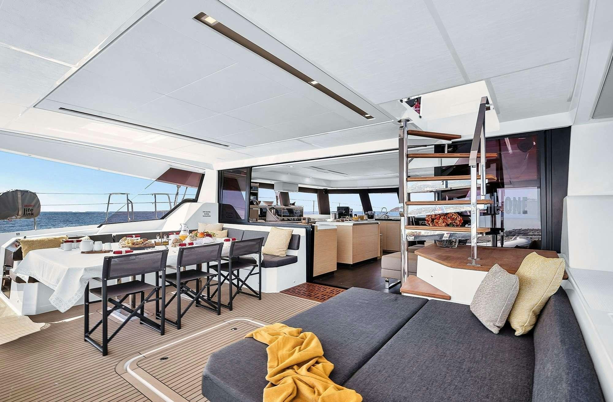 a living room with a large open window aboard ALEGRIA 67 Yacht for Charter