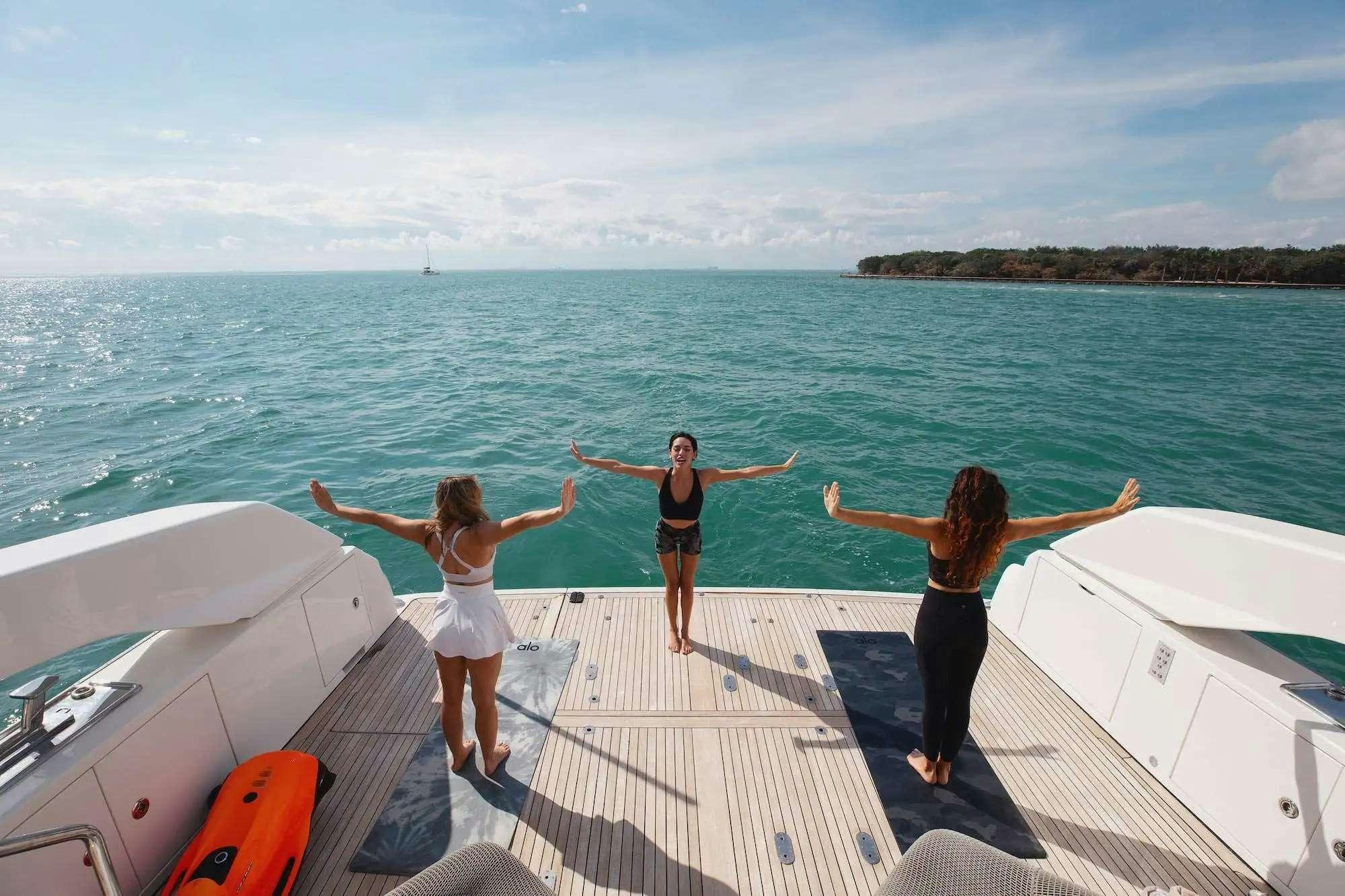 a group of women on a dock aboard 2019 SANLORENZO SX76 #16 Yacht for Charter
