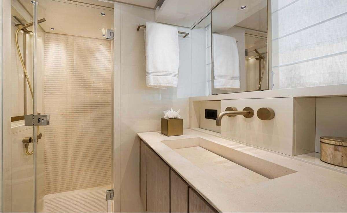 a bathroom with a sink and a mirror aboard 2019 SANLORENZO SX76 #16 Yacht for Charter