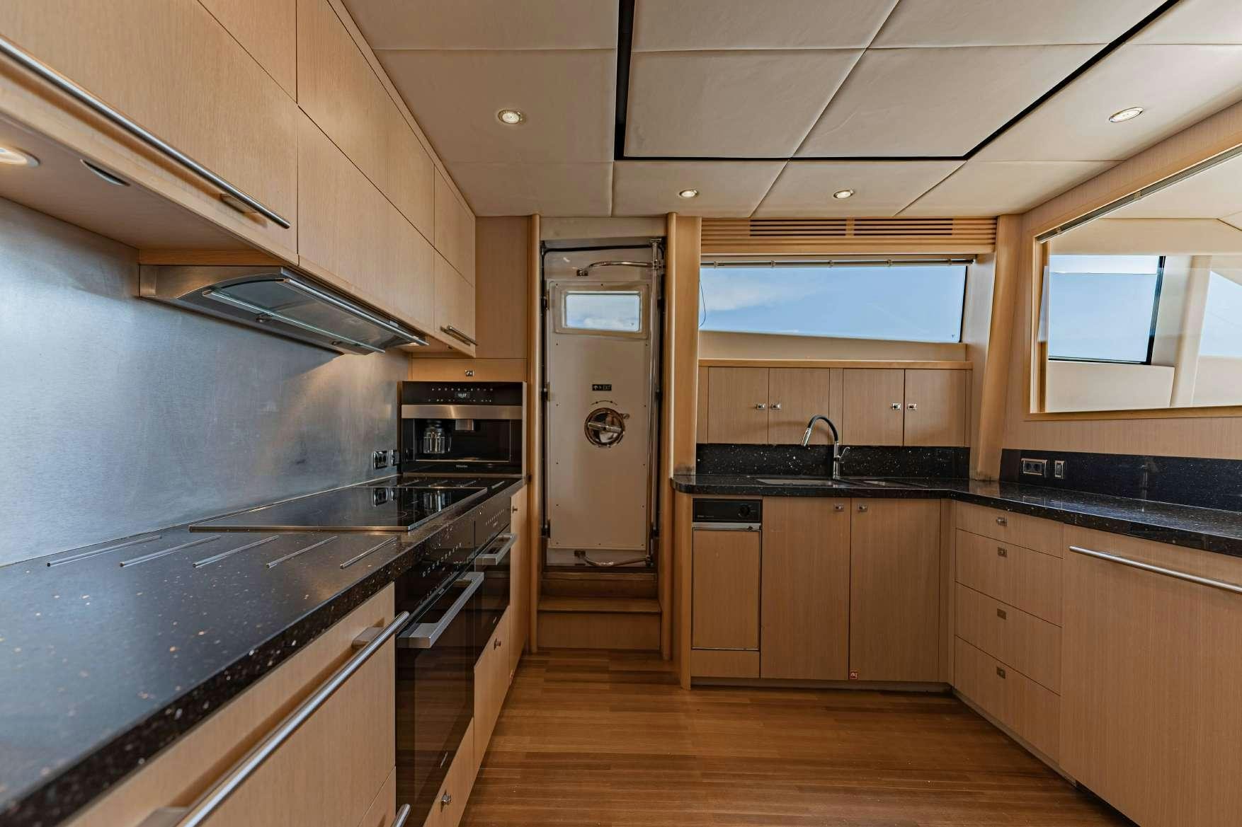 a kitchen with a stove and oven aboard BLUE EYES Yacht for Charter