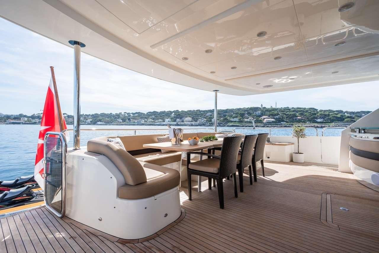 a room with a table and chairs aboard BLUE EYES Yacht for Charter