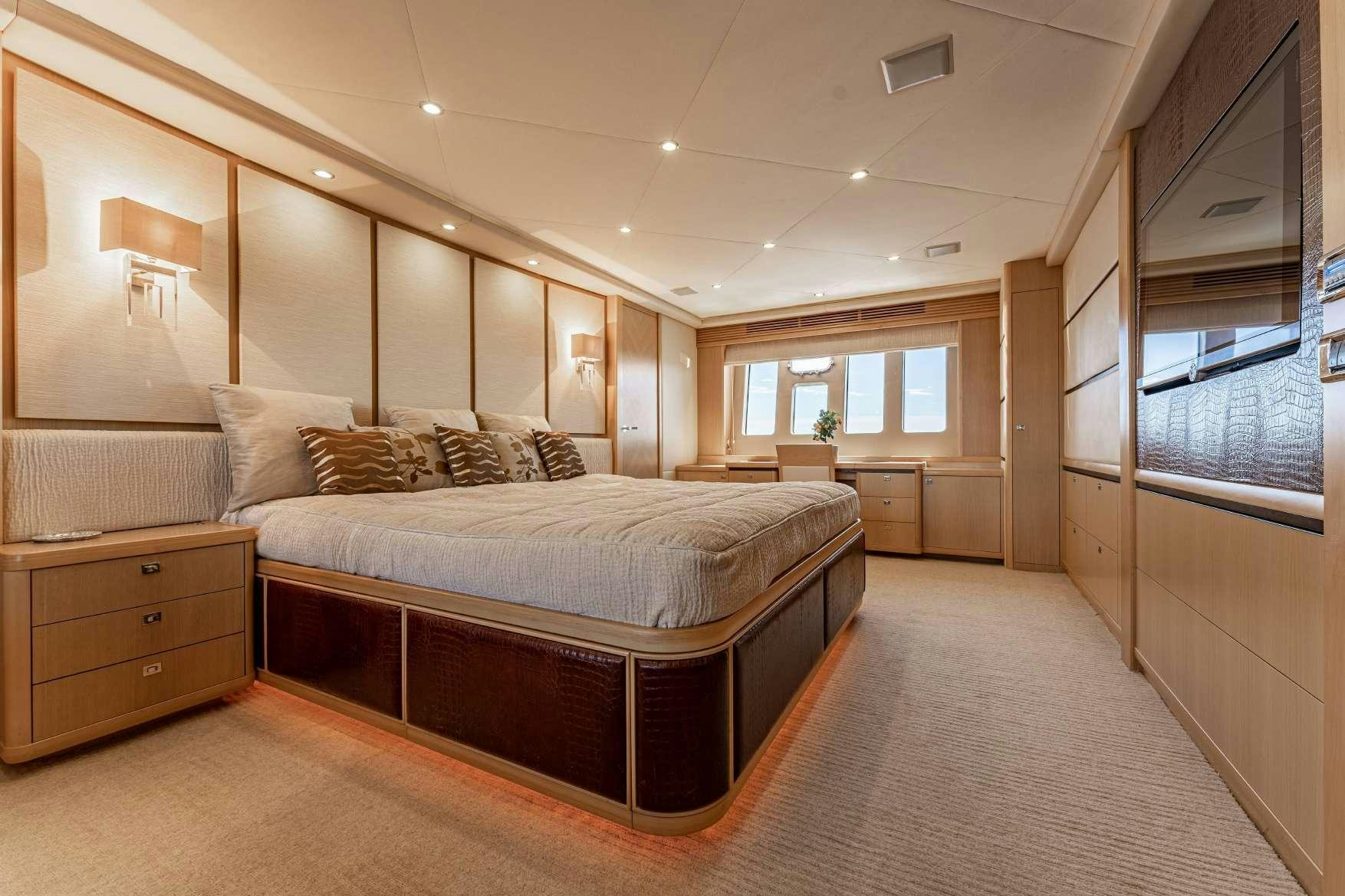 a large bedroom with a large bed aboard BLUE EYES Yacht for Charter