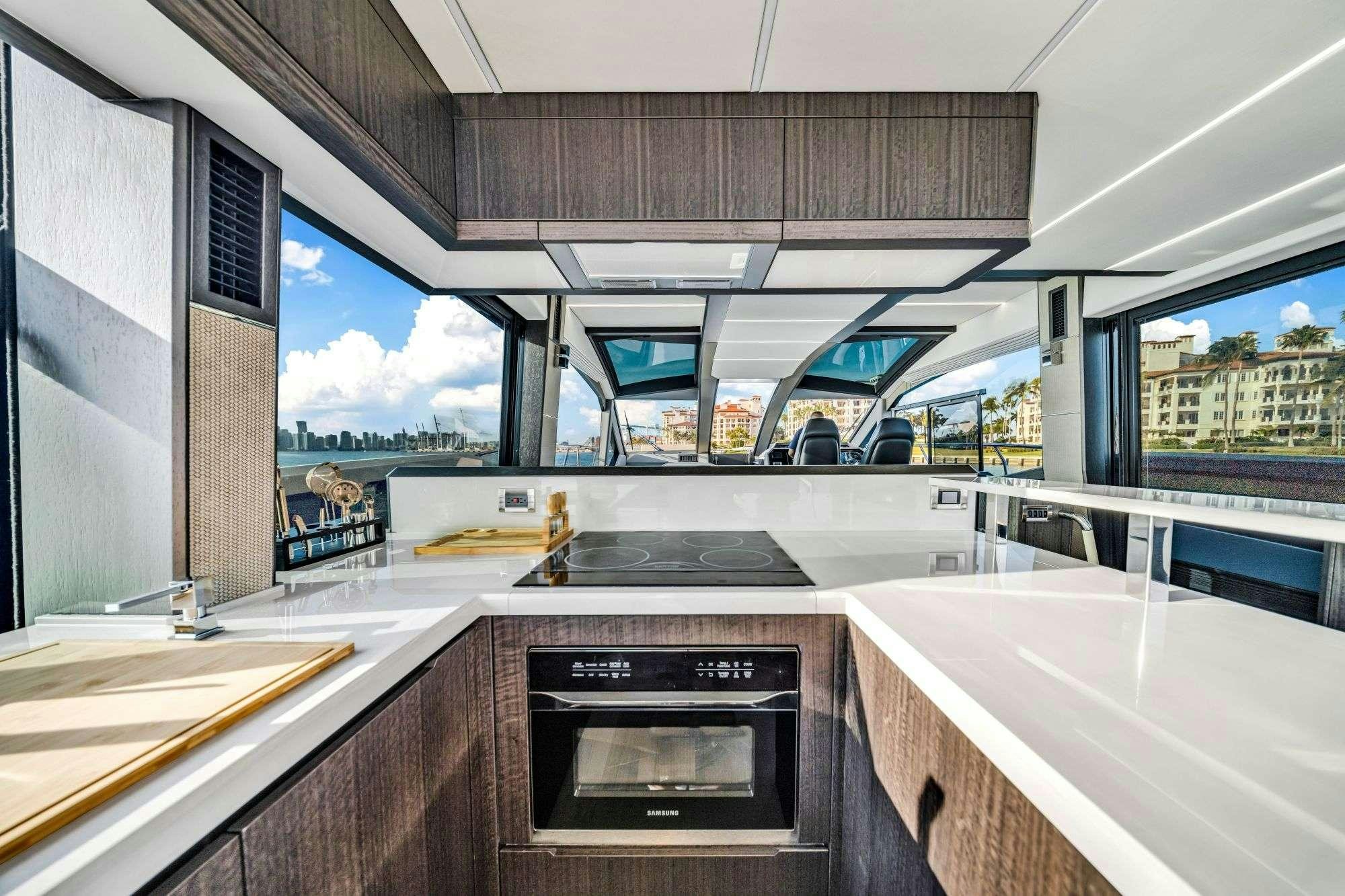 a kitchen with a large window aboard OPTIMUS PRIME Yacht for Charter