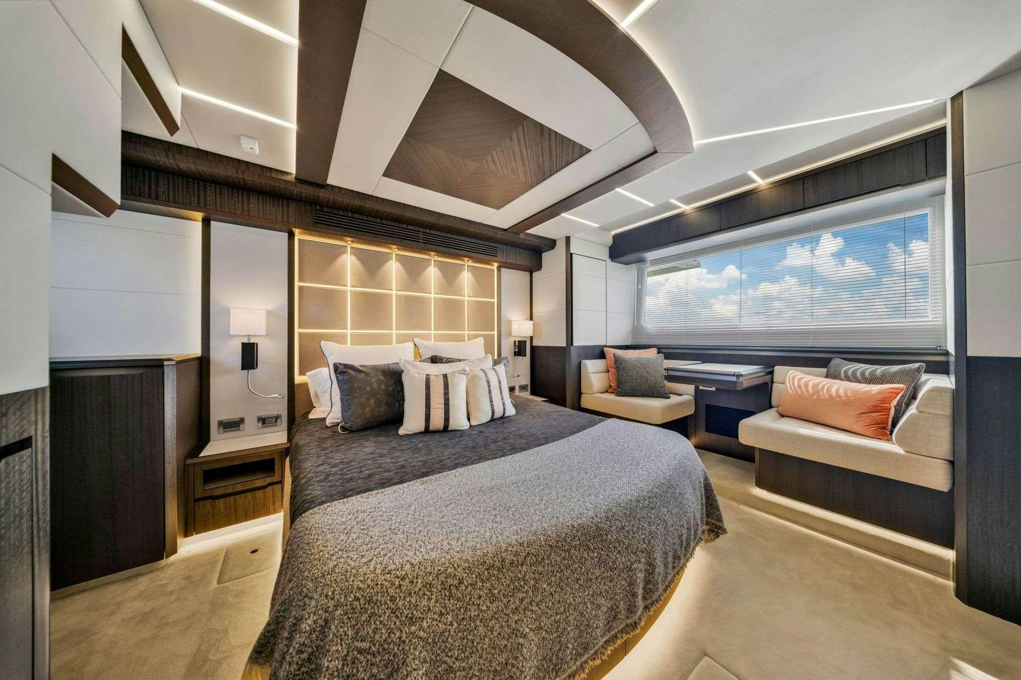 a large bedroom with a large bed aboard OPTIMUS PRIME Yacht for Charter