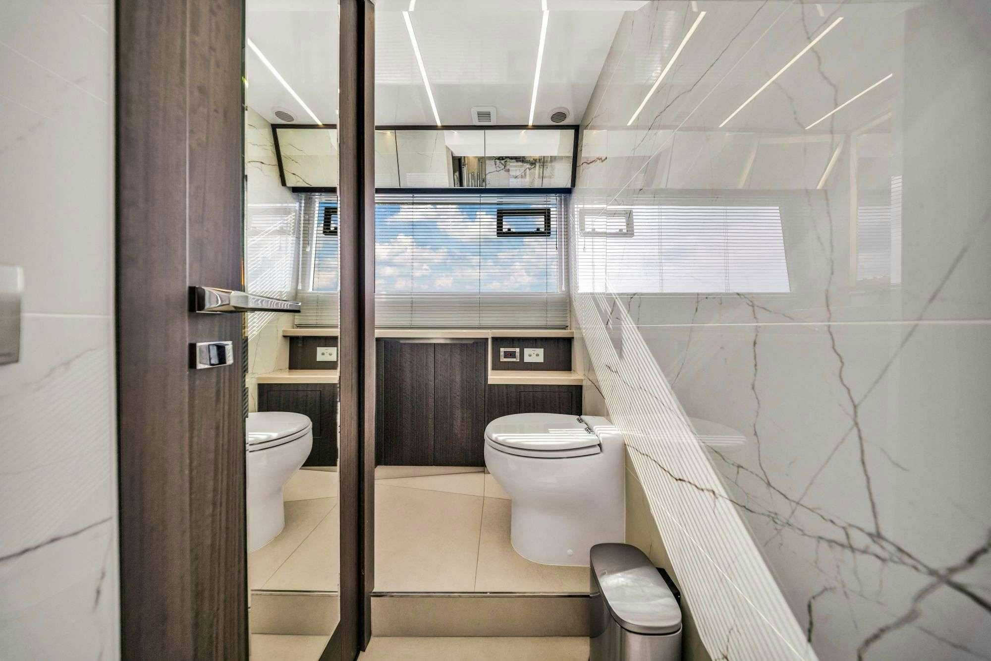 a bathroom with a glass door aboard OPTIMUS PRIME Yacht for Charter