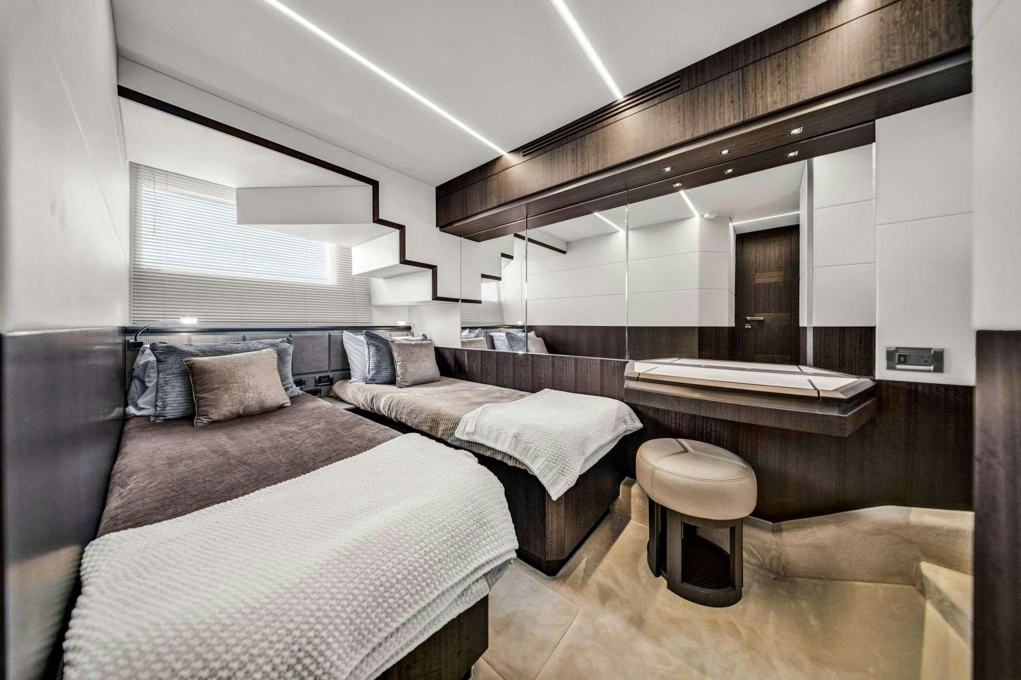 a room with two beds aboard OPTIMUS PRIME Yacht for Charter