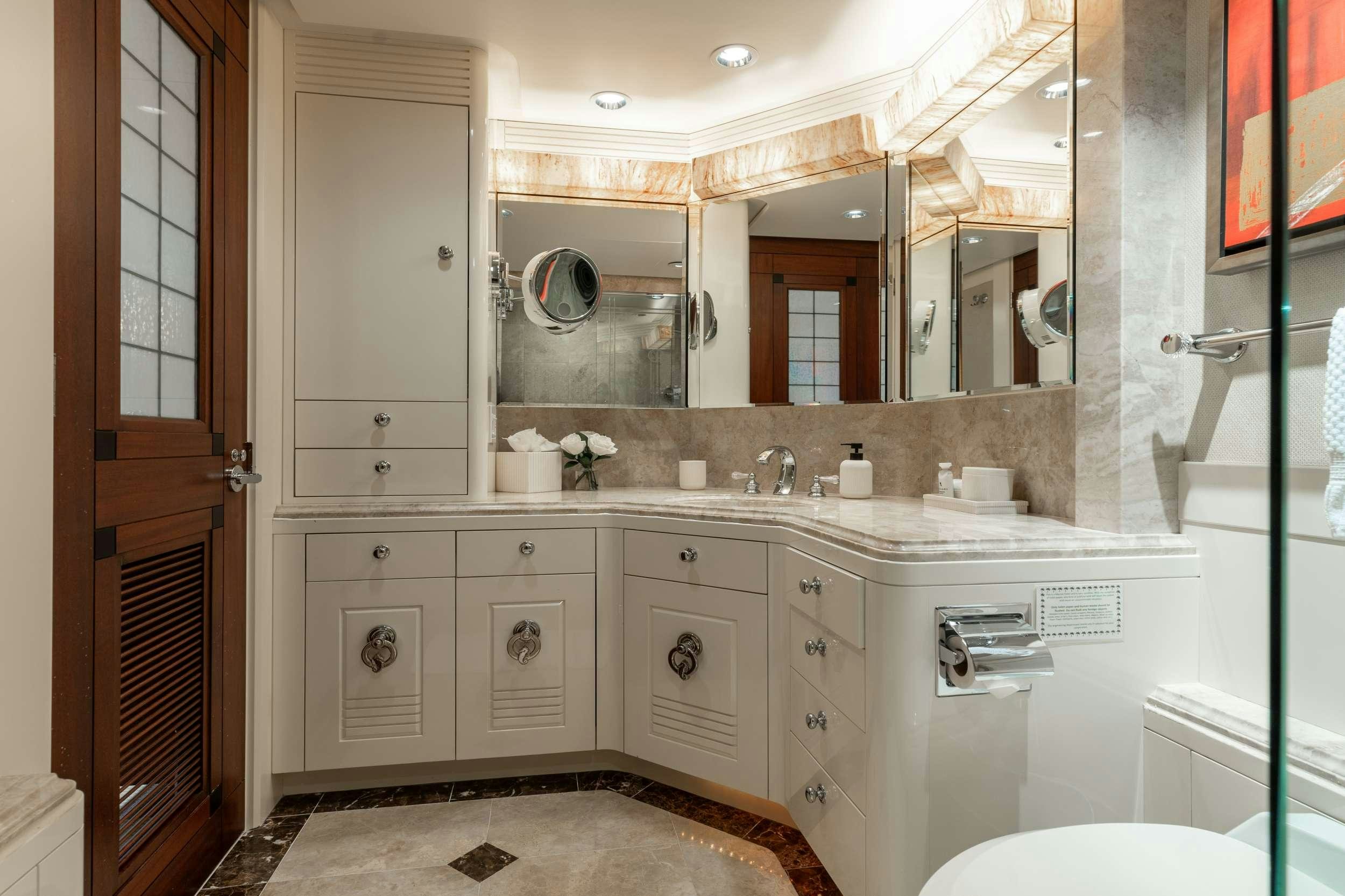 a bathroom with a large mirror aboard LANIDA Yacht for Charter