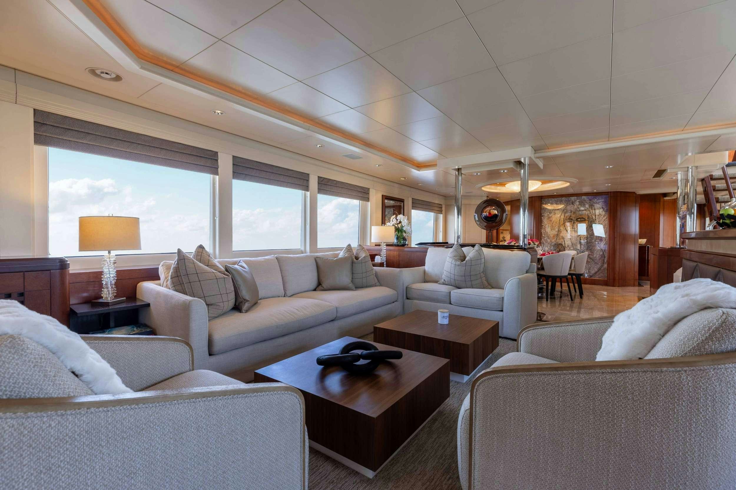 a living room with a couch and a coffee table aboard LANIDA Yacht for Charter