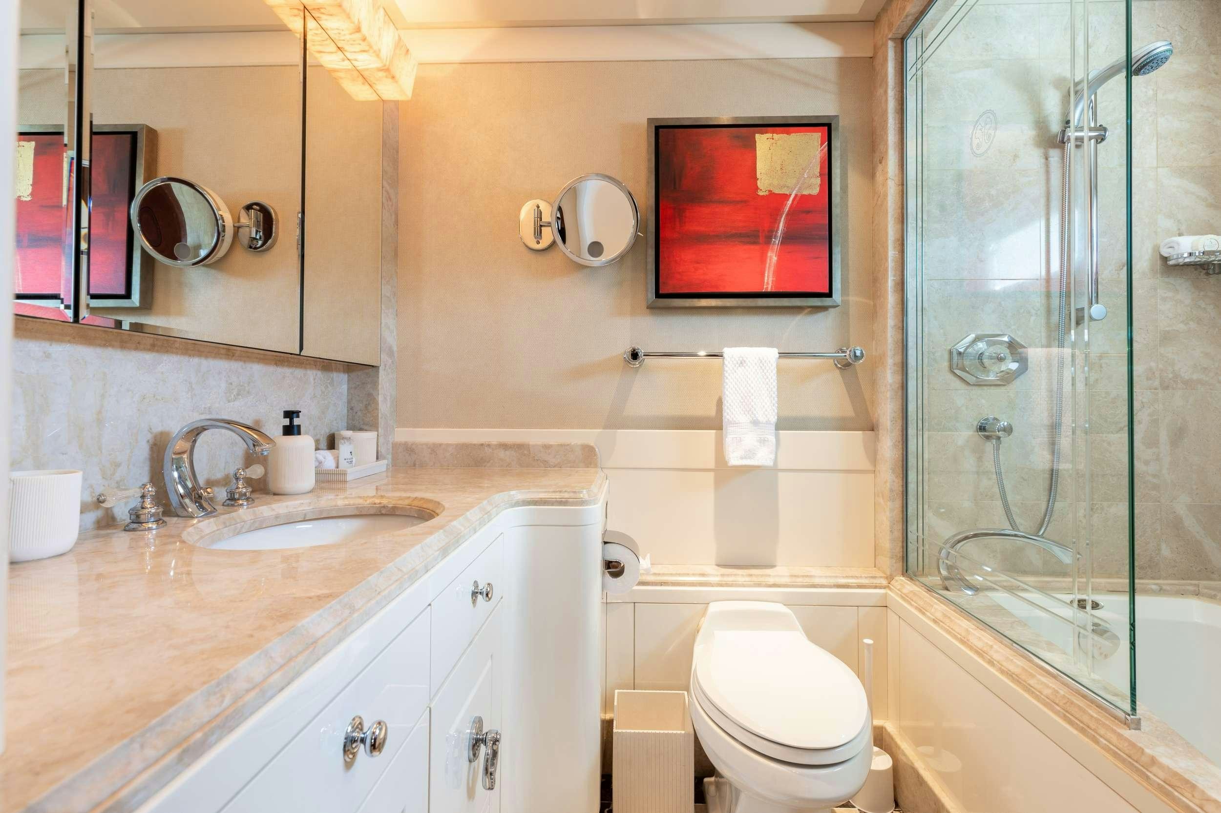 a bathroom with a glass shower aboard LANIDA Yacht for Charter