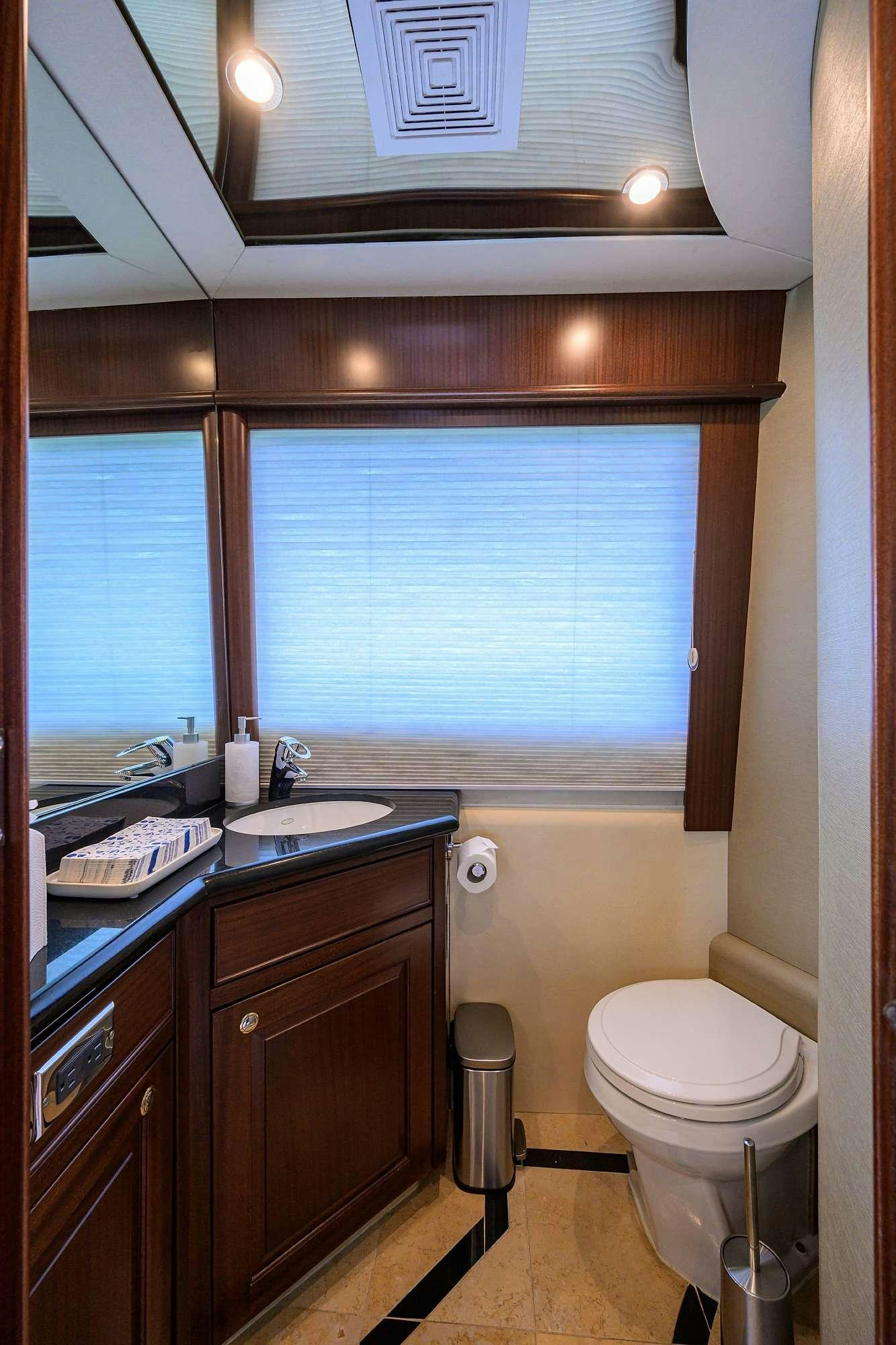 a bathroom with a sink and a toilet aboard JULE Yacht for Charter