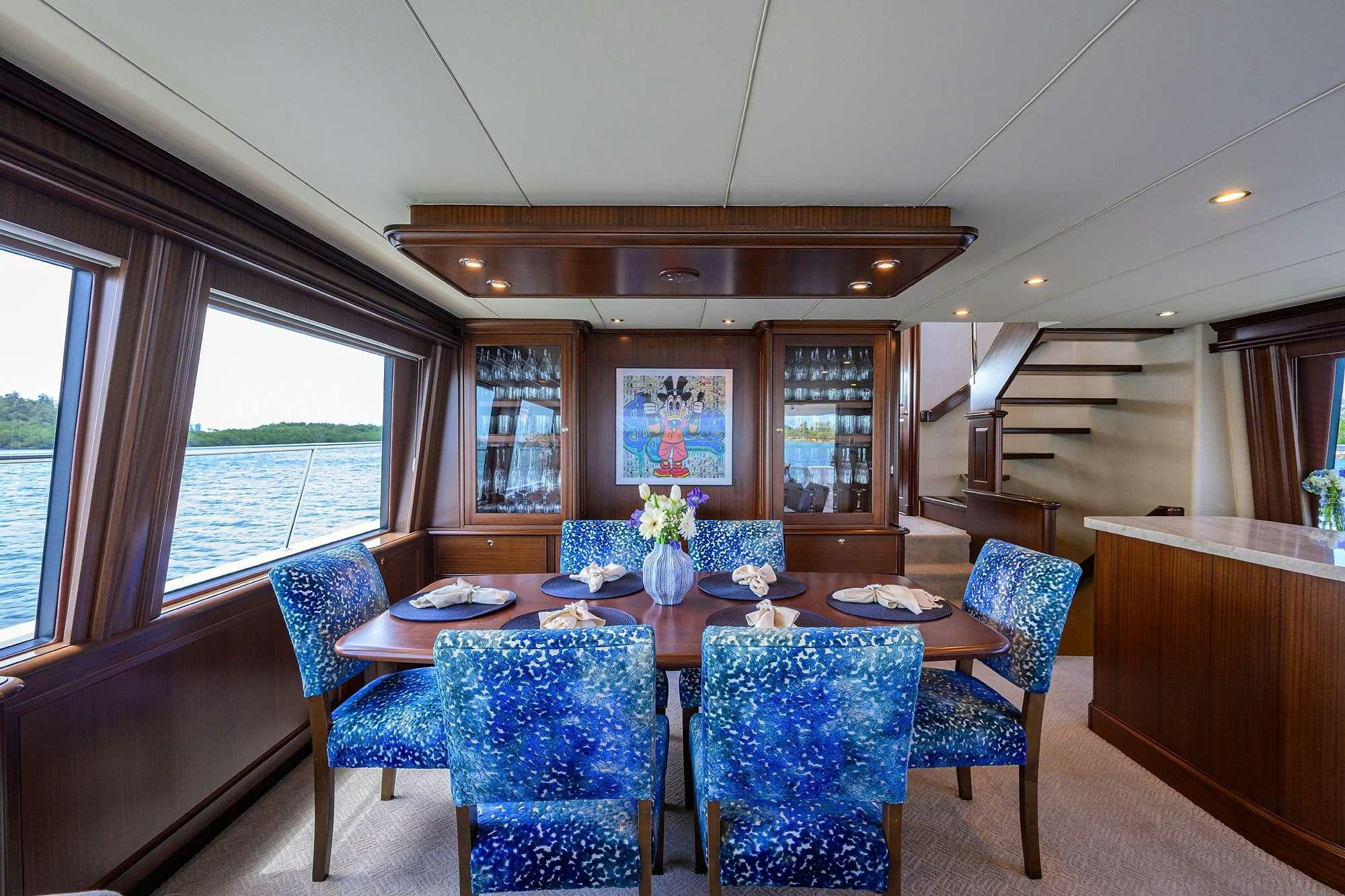a dining room with a table aboard JULE Yacht for Charter