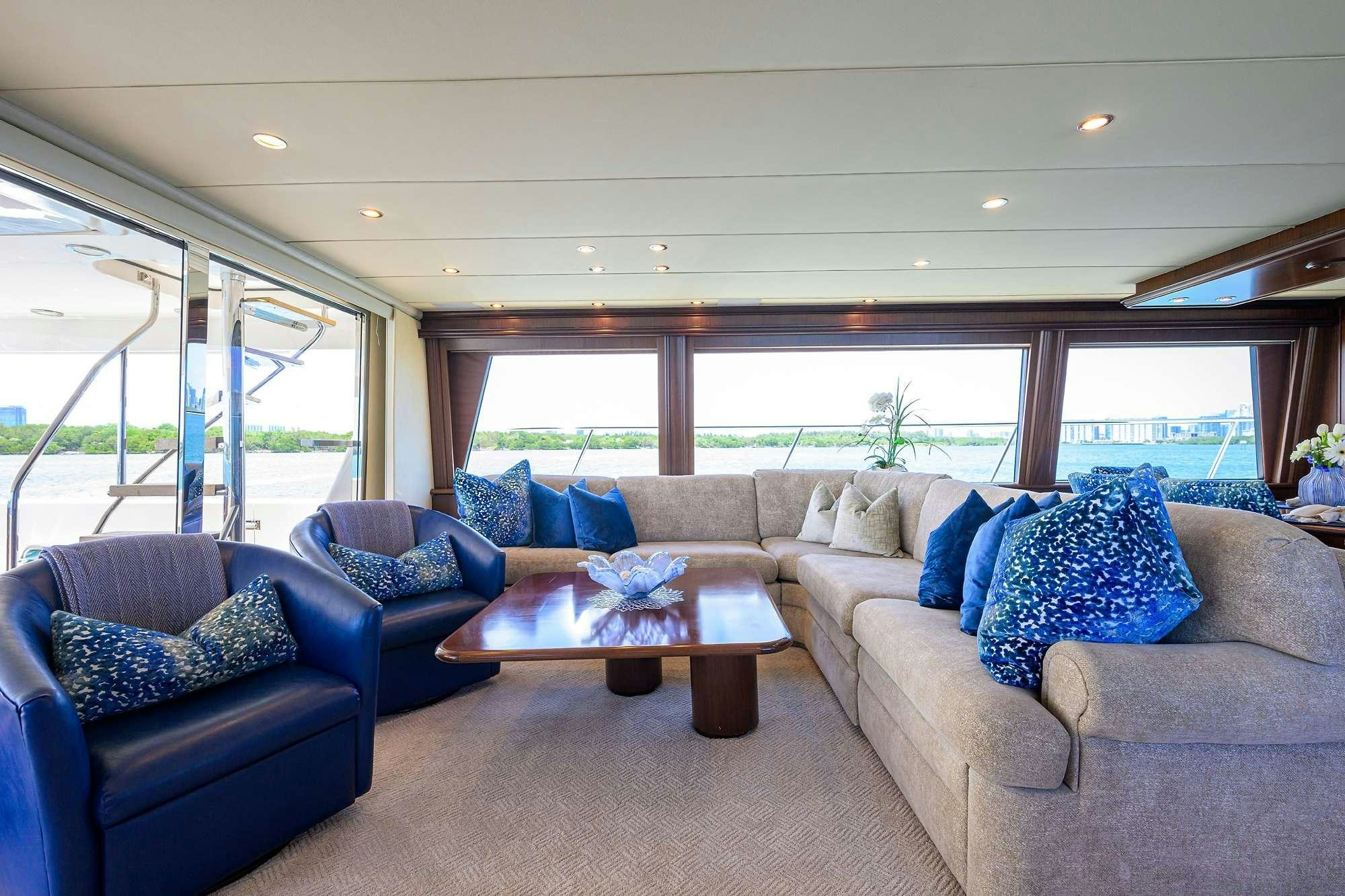 a living room with a large window aboard JULE Yacht for Charter