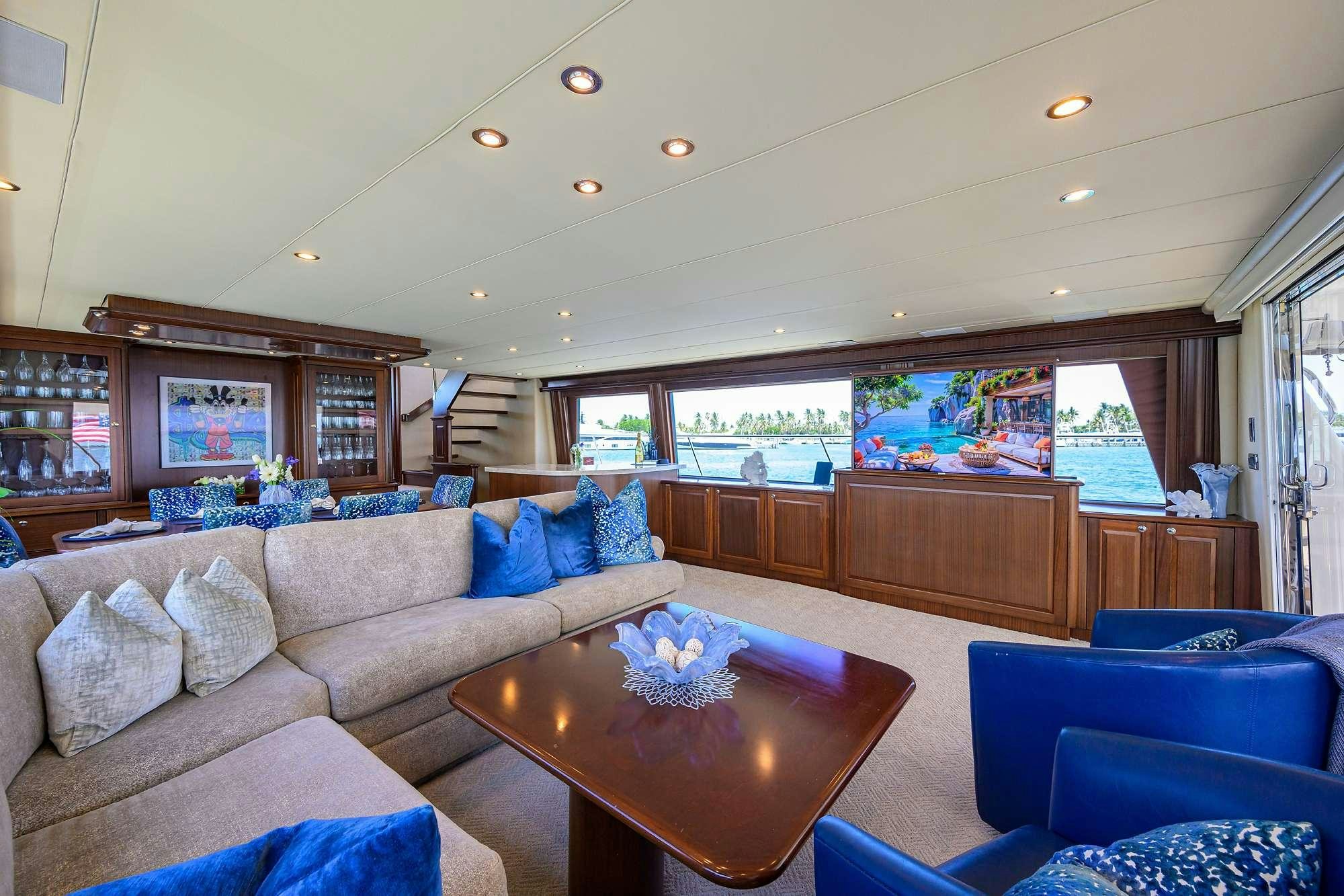 a living room with a large window aboard JULE Yacht for Charter
