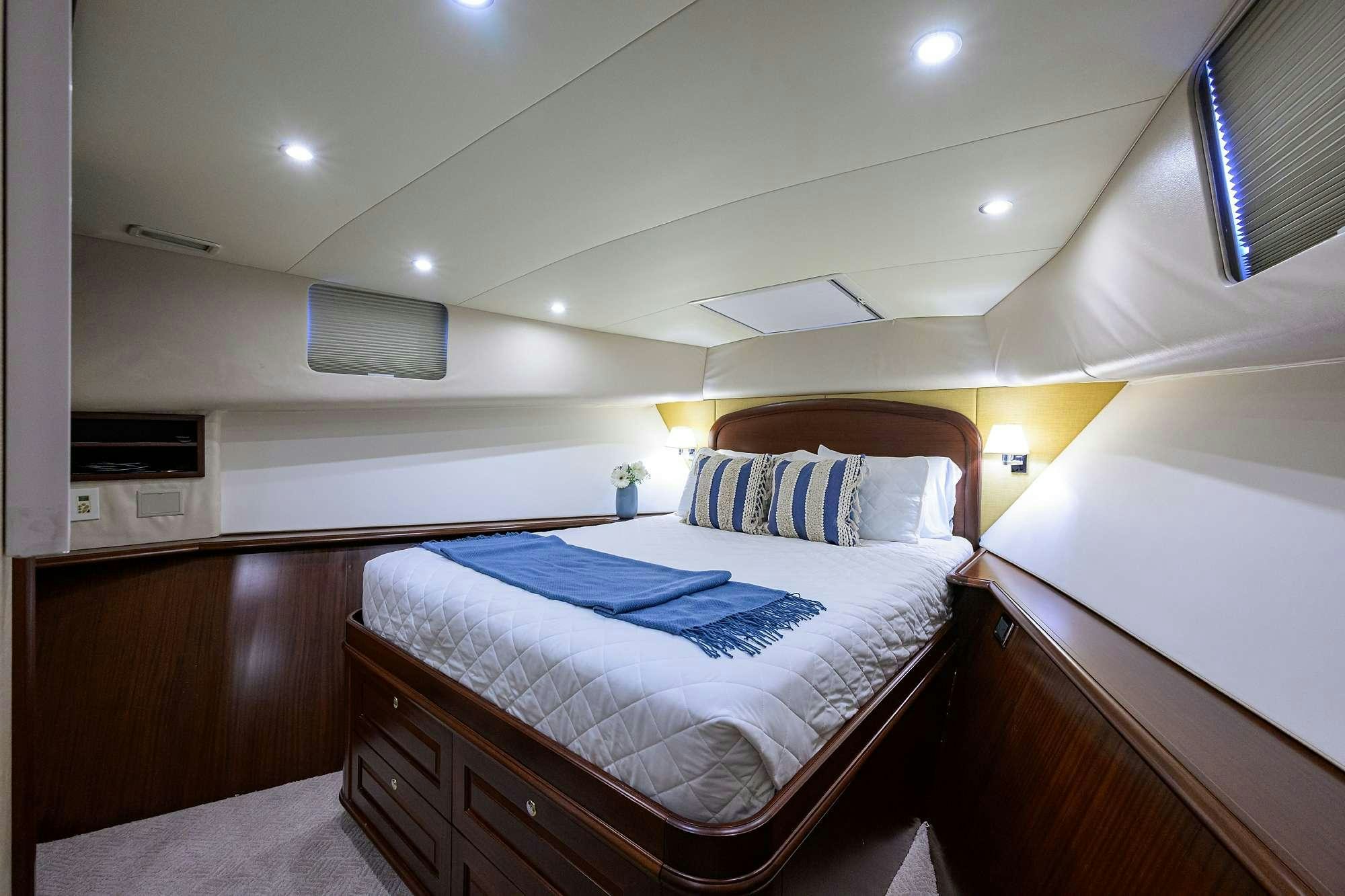a couple of beds in a hotel room aboard JULE Yacht for Charter