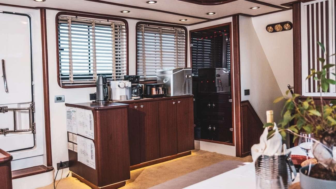 a kitchen with a large island aboard LUJA Yacht for Charter