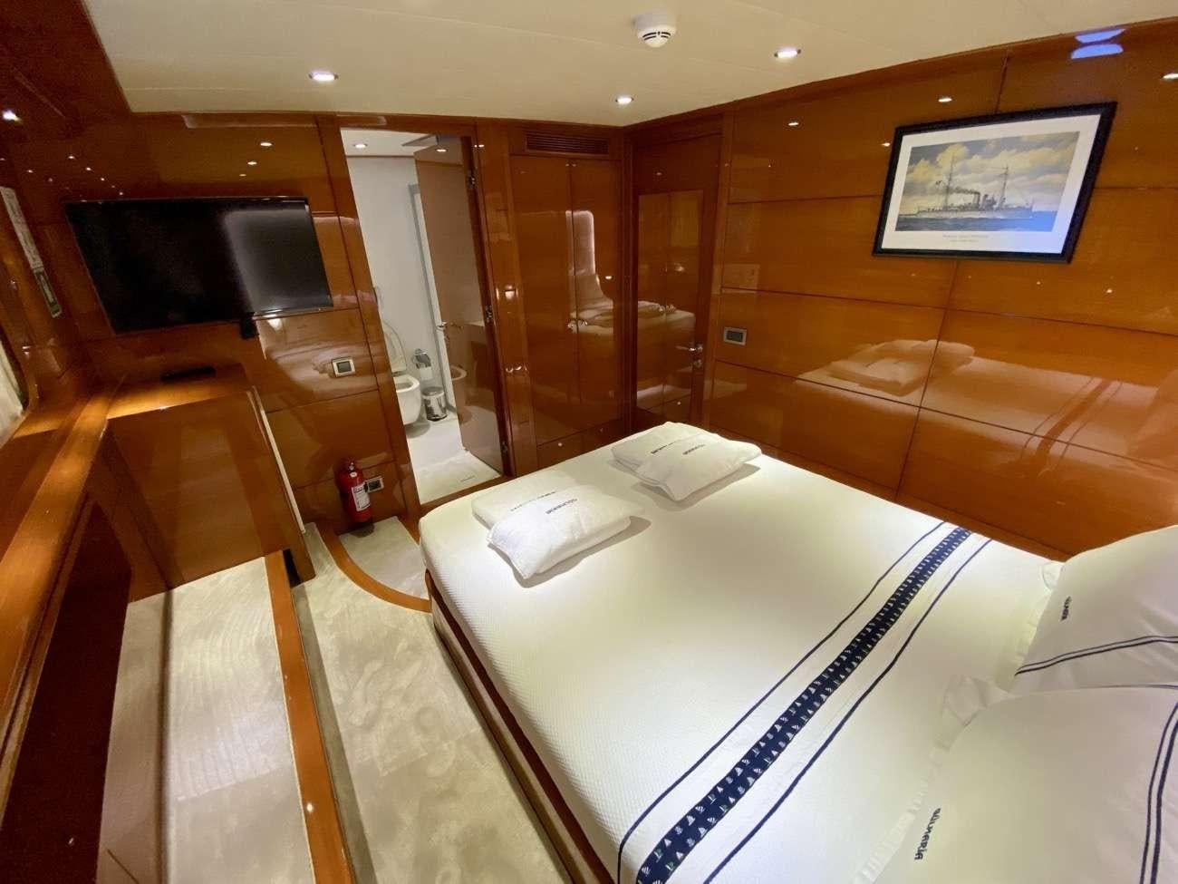 a bed in a room aboard CANARIA Yacht for Charter