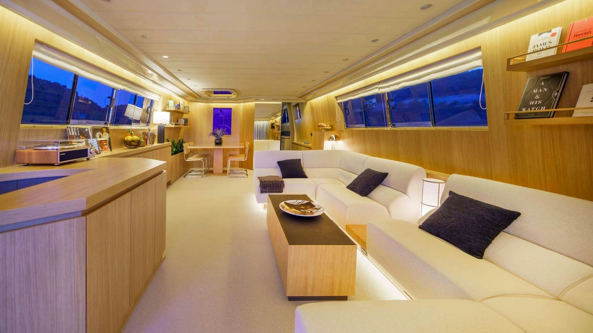 a room with a couch and a table aboard PHANTOM Yacht for Charter