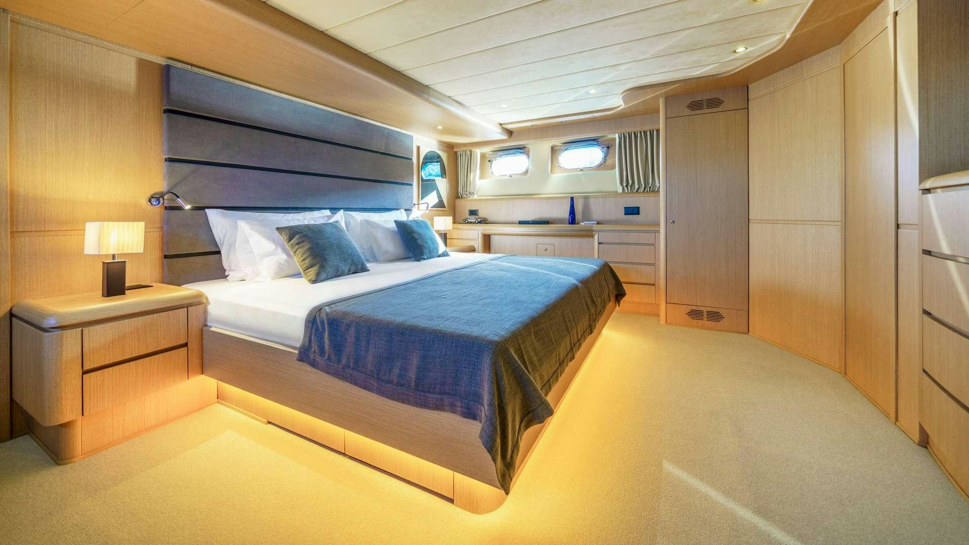 a large bed in a room aboard PHANTOM Yacht for Charter