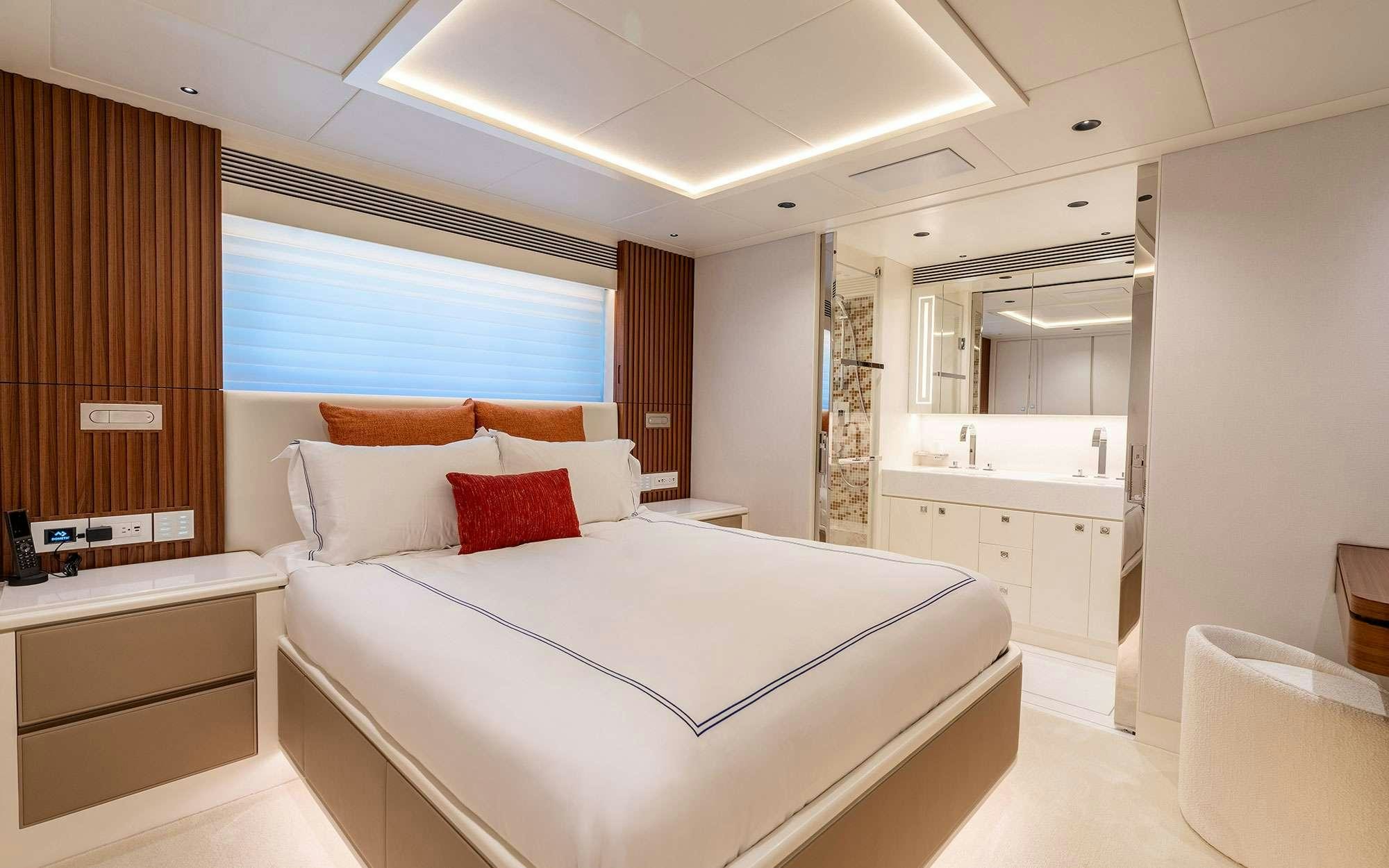 a large white bed in a room aboard MISS MICHELLE Yacht for Charter