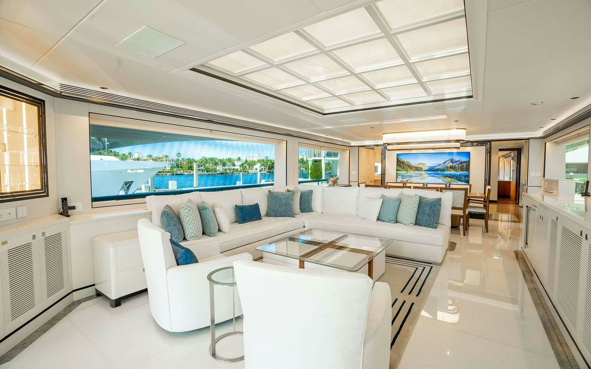 a living room with a couch and a table aboard MISS MICHELLE Yacht for Charter