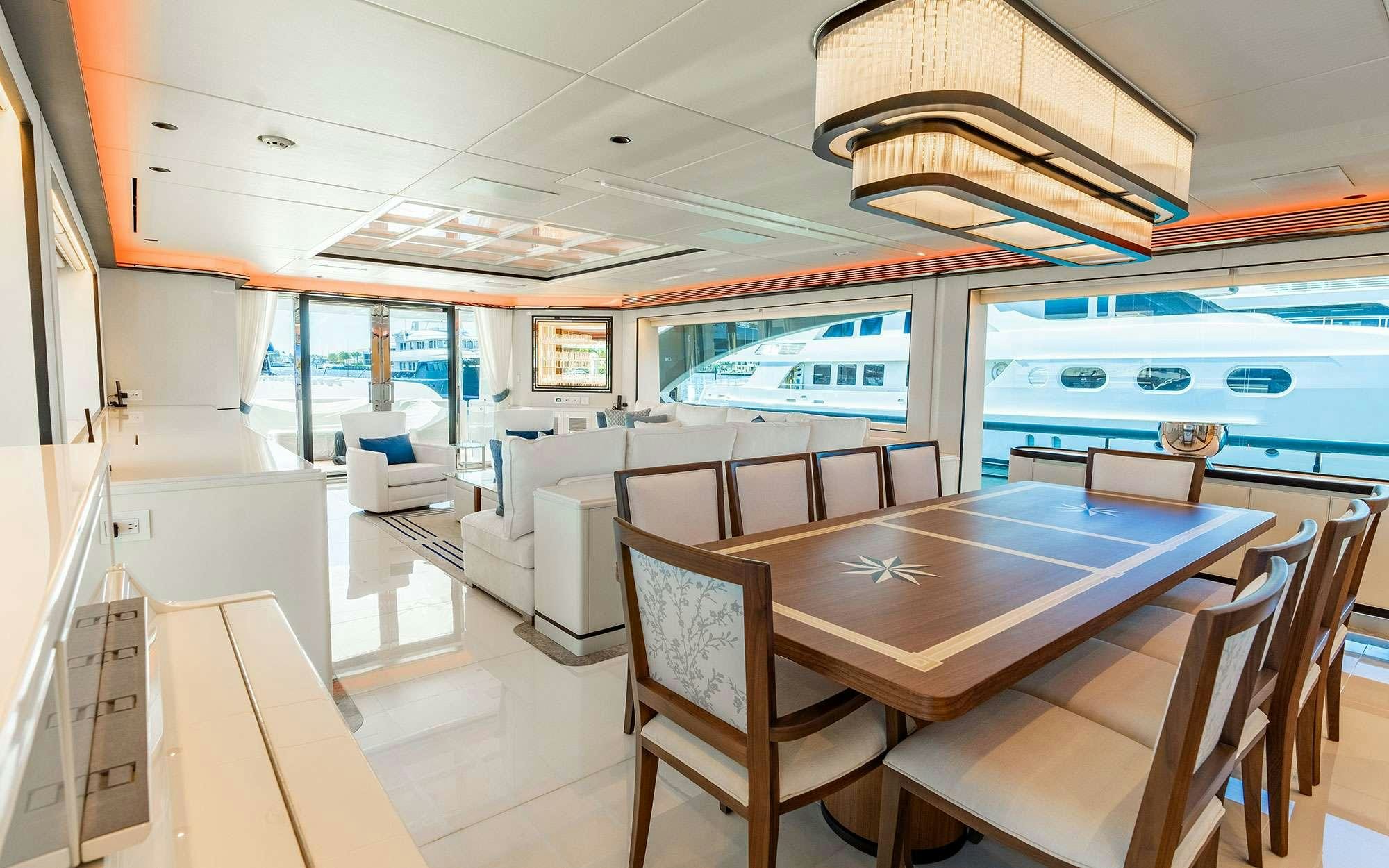 a room with a table and chairs aboard MISS MICHELLE Yacht for Charter