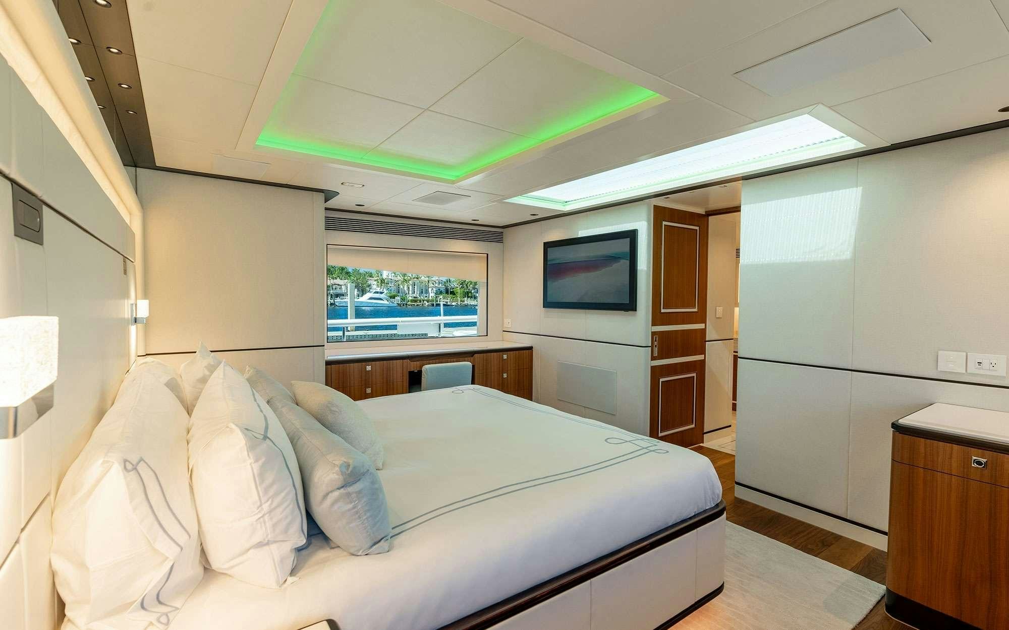 a bedroom with a large bed aboard MISS MICHELLE Yacht for Charter