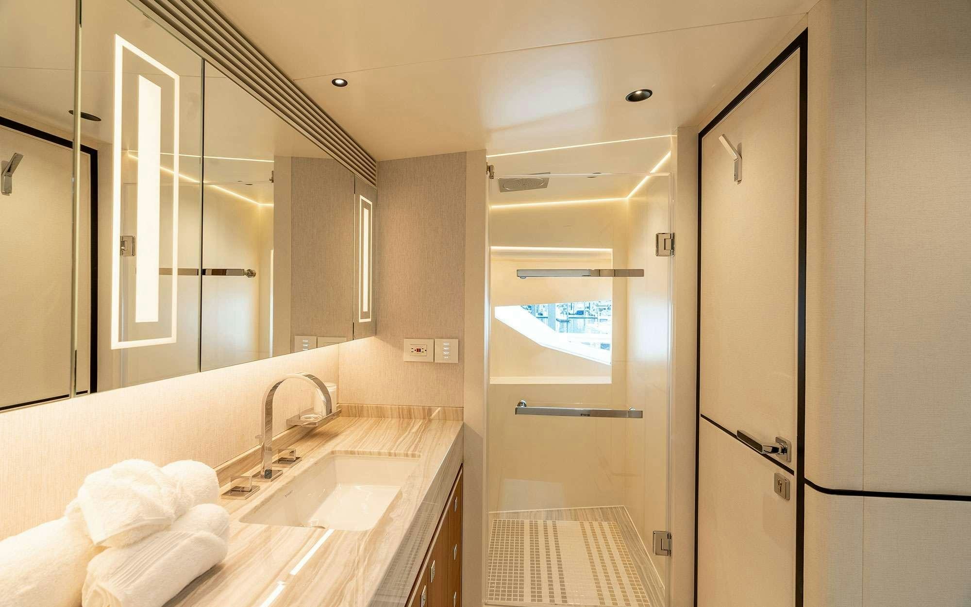 a bathroom with a sink and a mirror aboard MISS MICHELLE Yacht for Charter