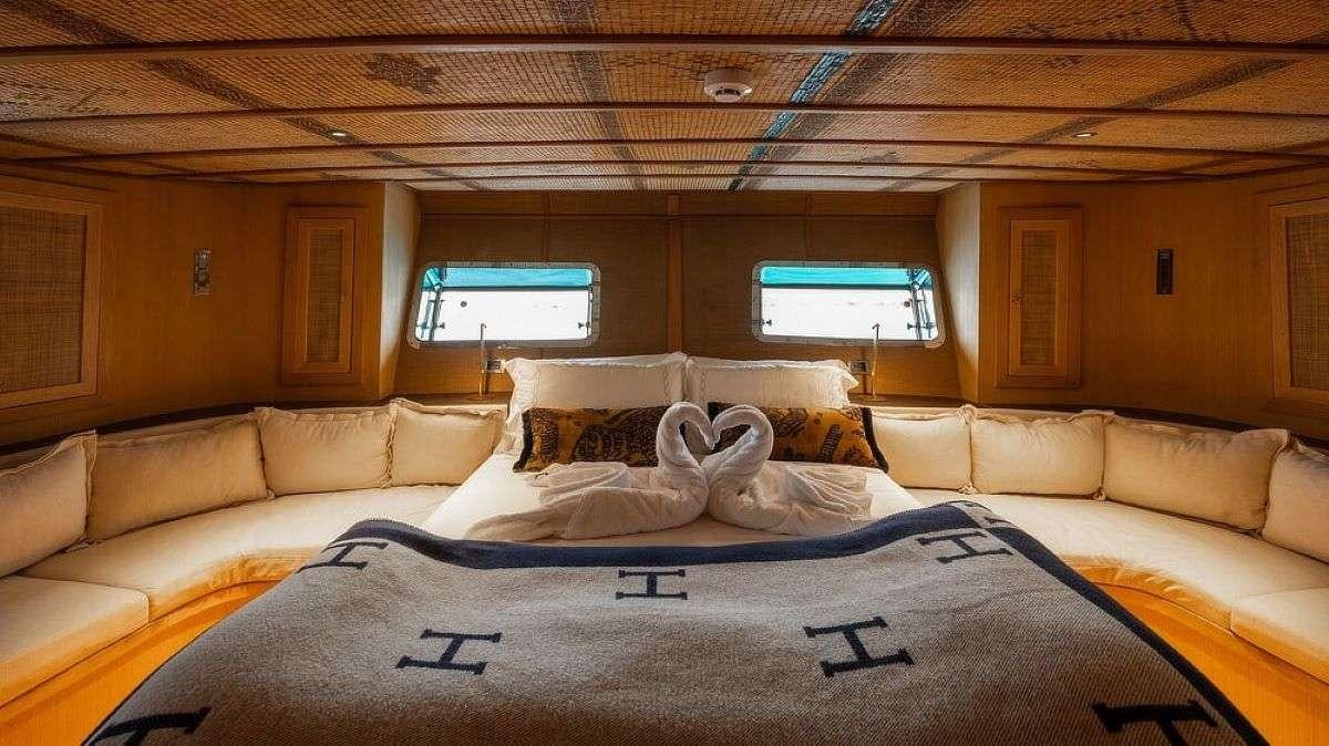 a room with couches and a television aboard MY LOVER Yacht for Charter