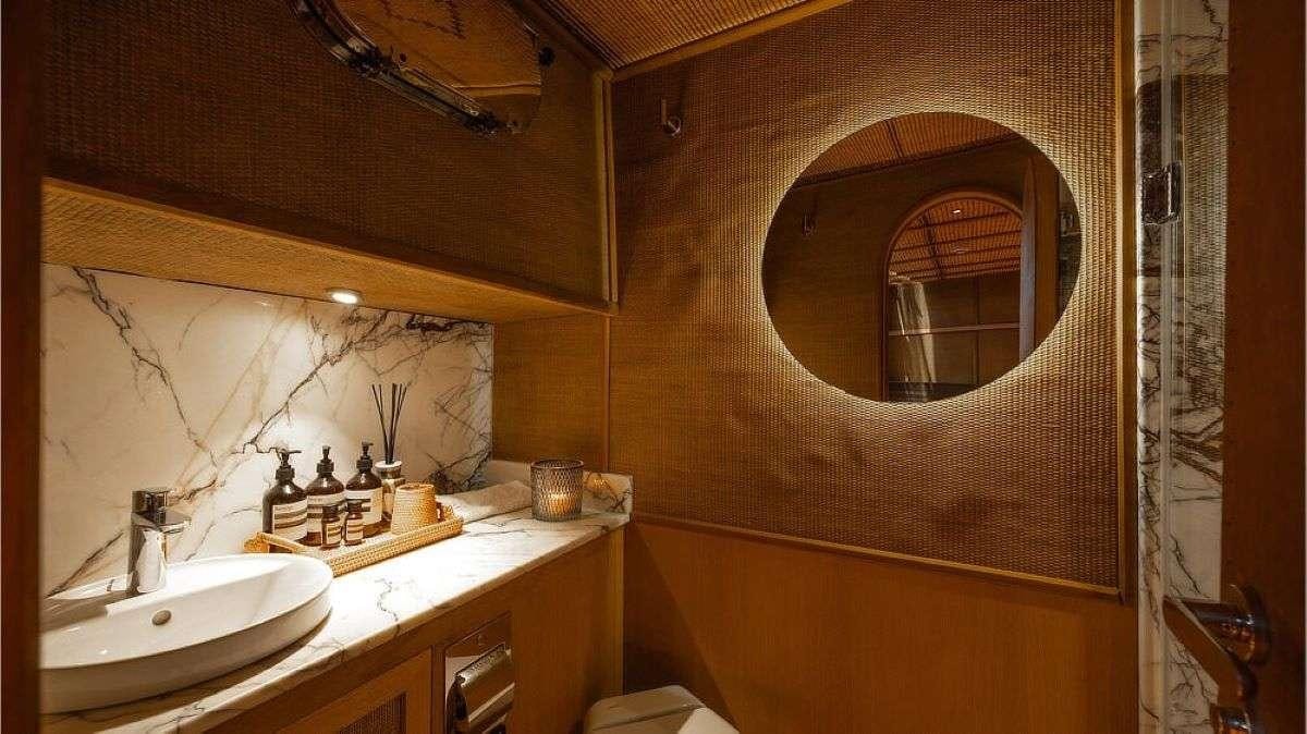 a bathroom with a mirror and a sink aboard MY LOVER Yacht for Charter