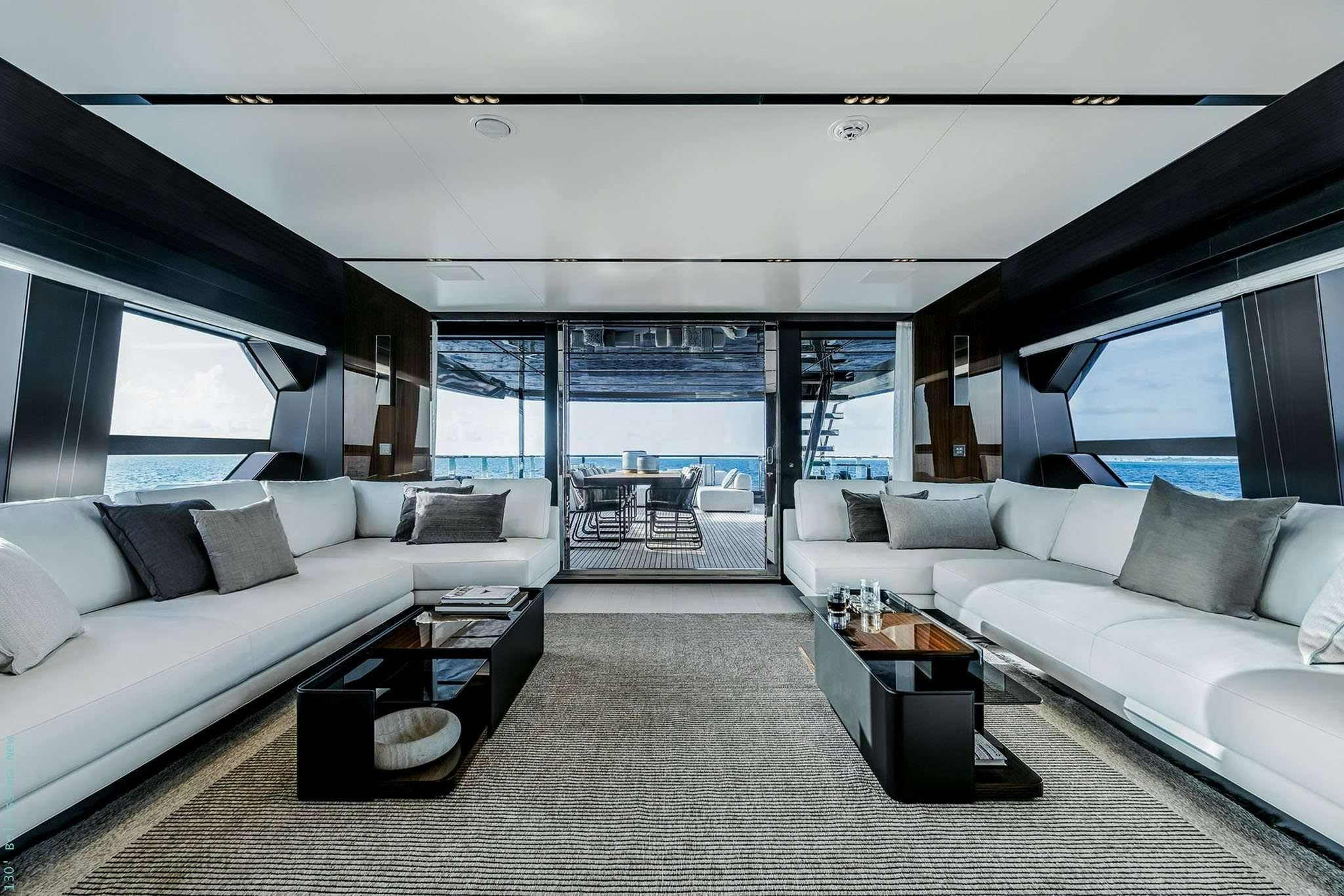 a living room with a large window aboard TASTY WAVES Yacht for Charter