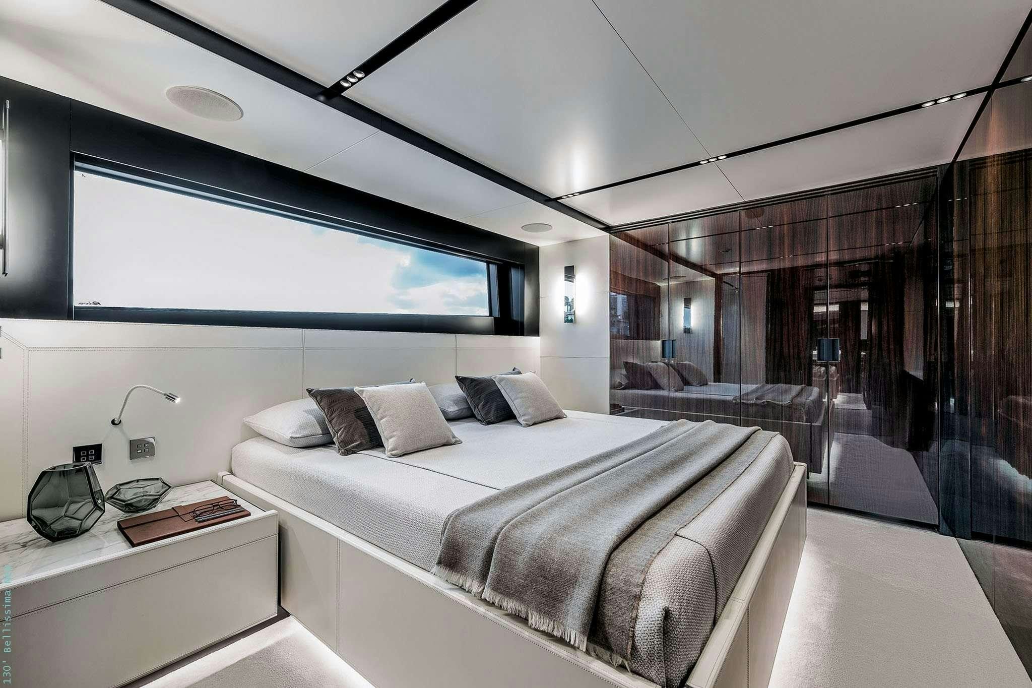 a room with a bed and a window aboard TASTY WAVES Yacht for Charter