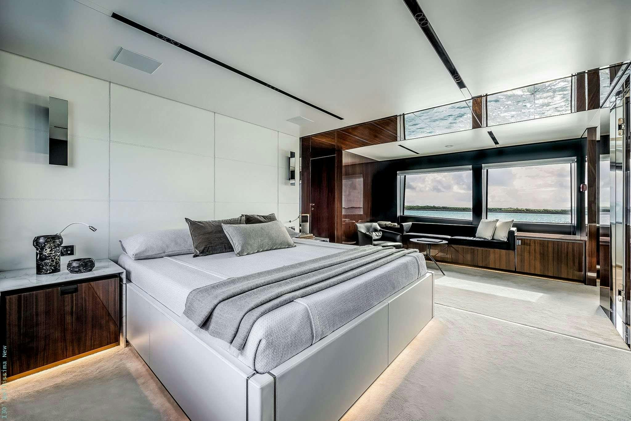 a bedroom with a large bed aboard TASTY WAVES Yacht for Charter