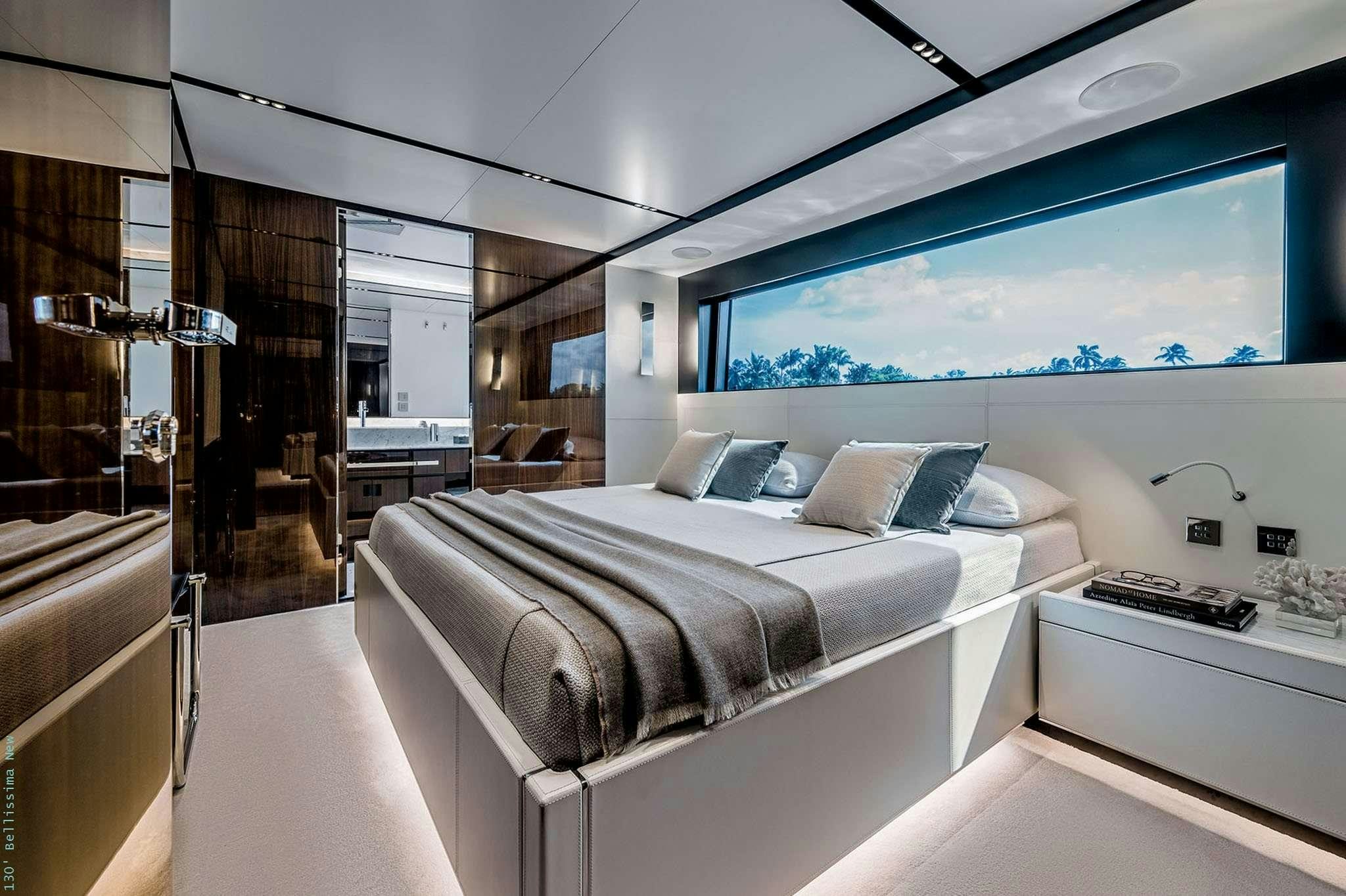 a room with a bed and a window aboard TASTY WAVES Yacht for Charter