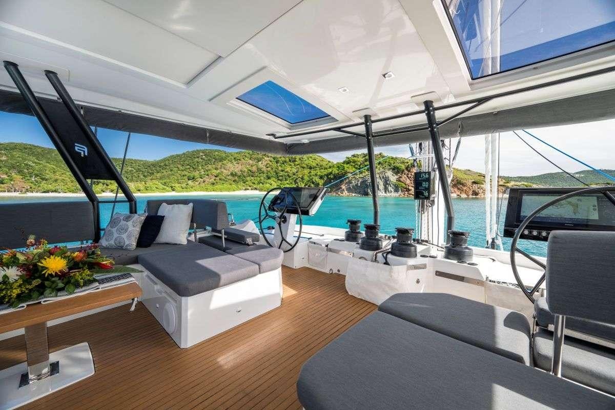a boat with a table and chairs aboard LYRA Yacht for Charter