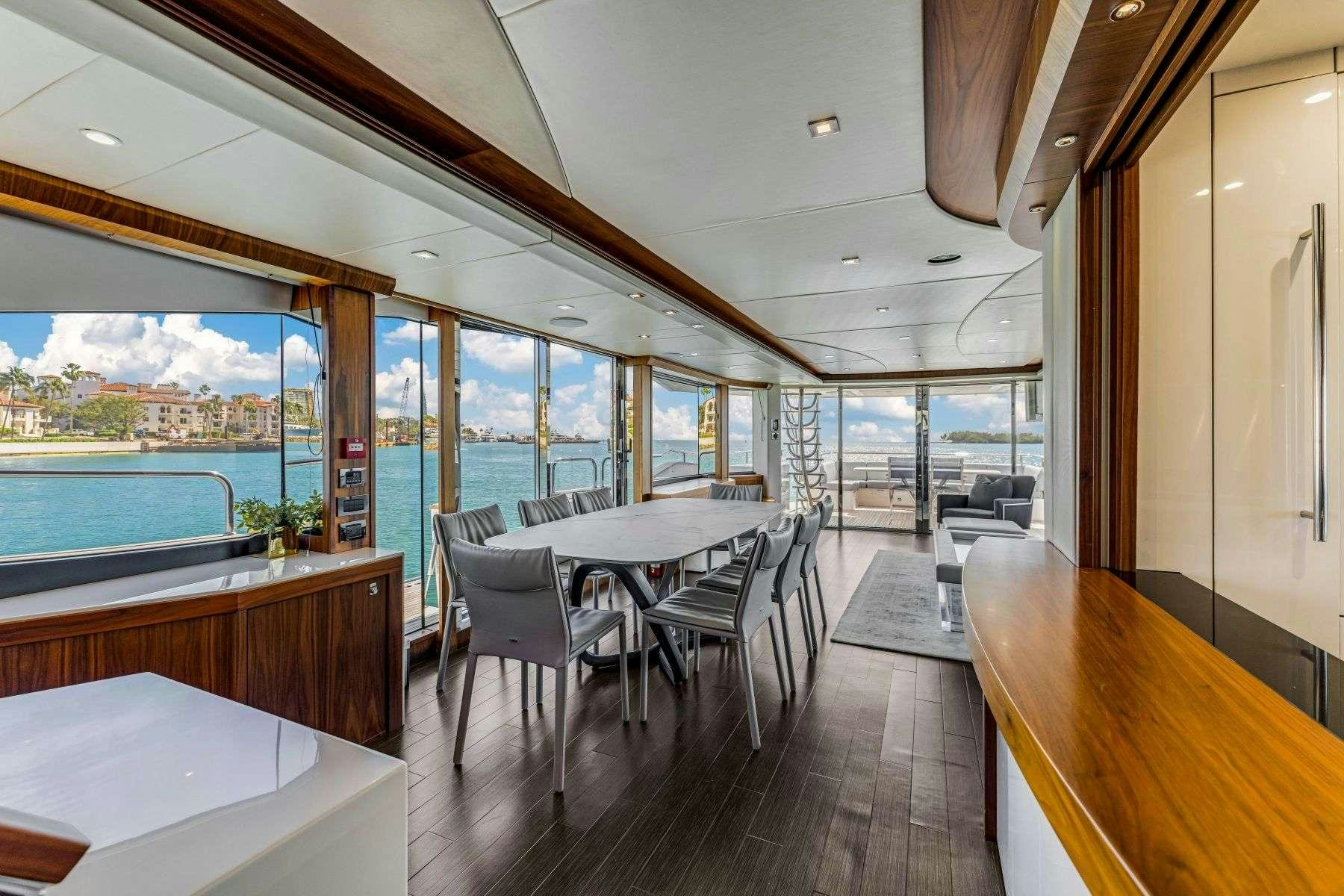 a room with a table and chairs aboard RMM JOB Yacht for Charter