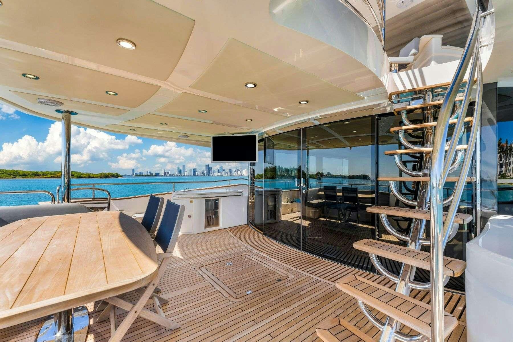 a room with a table and chairs aboard RMM JOB Yacht for Charter