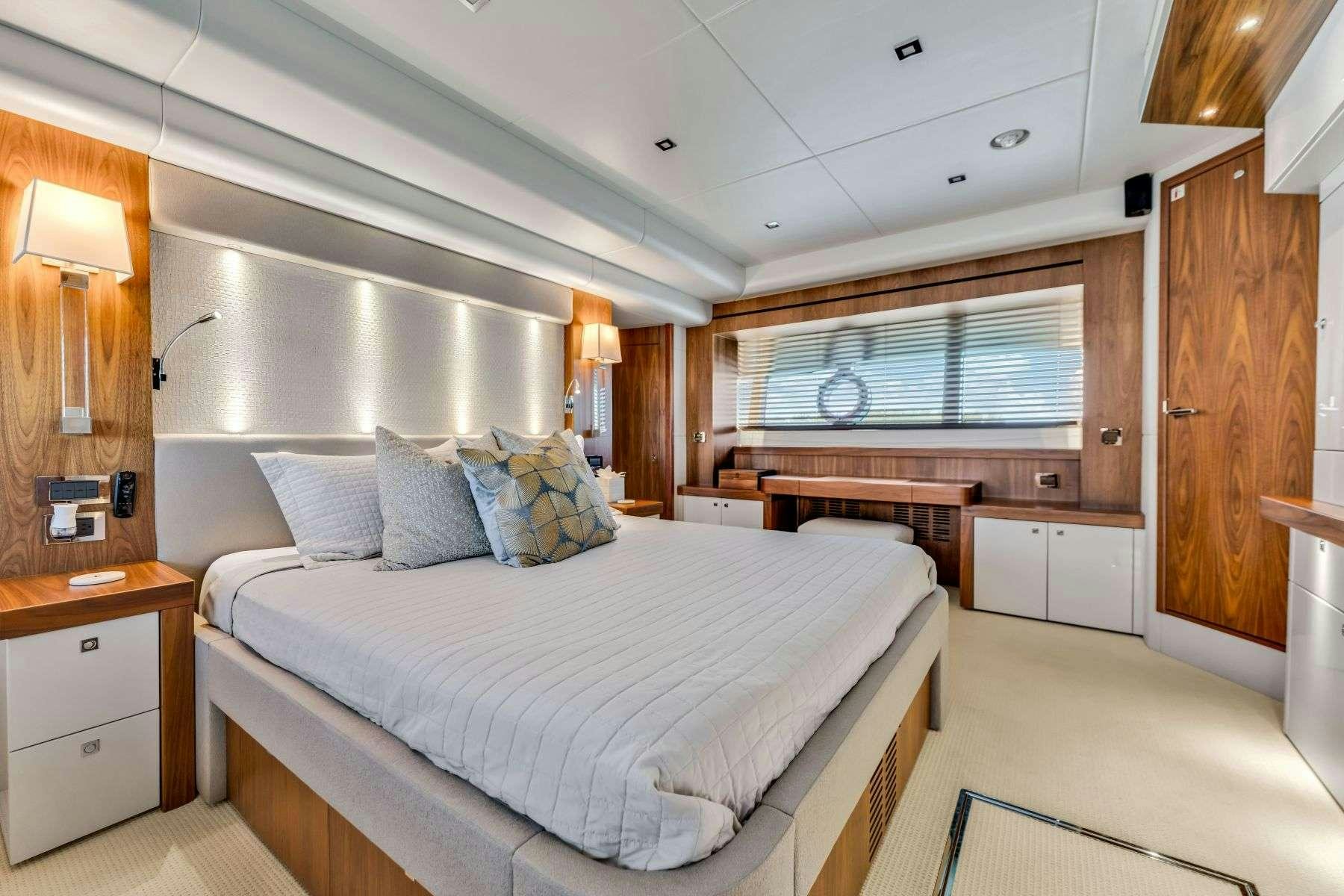 a room with a bed and a desk aboard RMM JOB Yacht for Charter