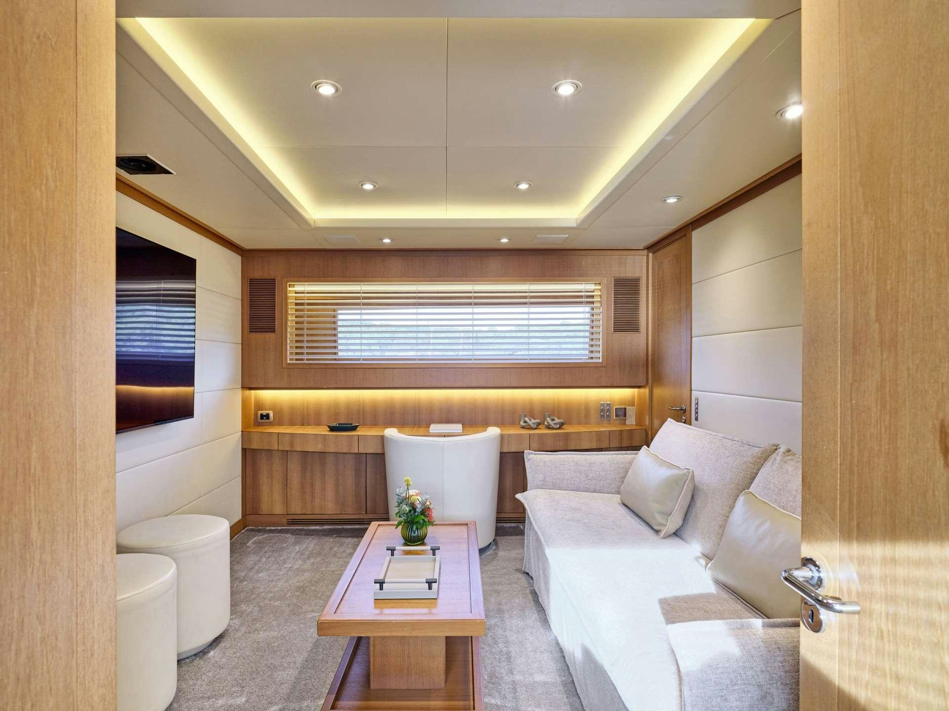 a living room with a couch and a table aboard TIGRA Yacht for Charter