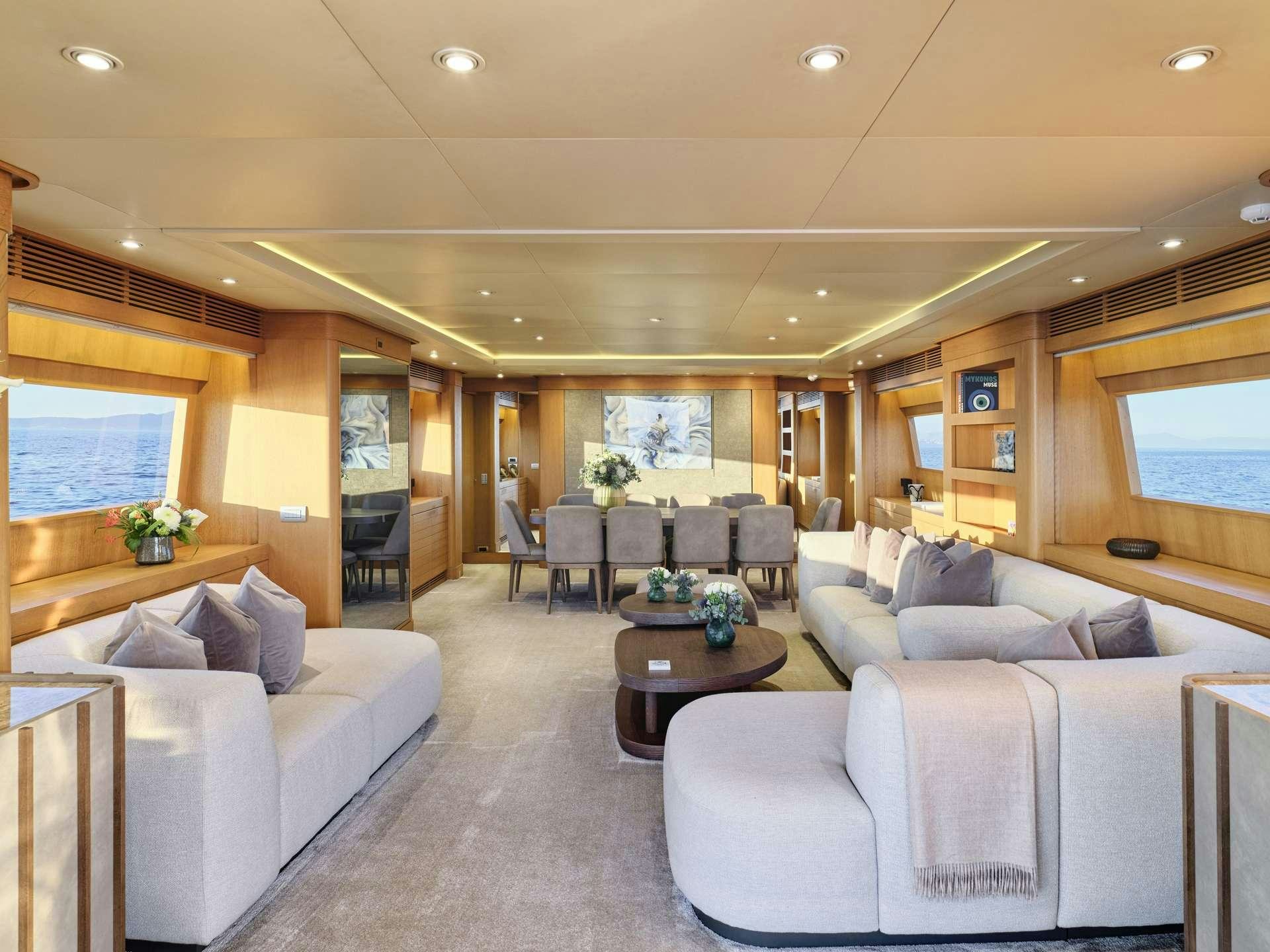 a living room with a large window aboard TIGRA Yacht for Charter