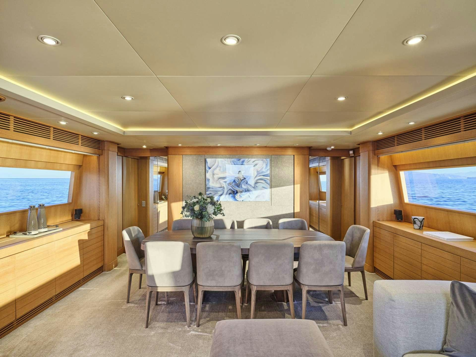 a large kitchen with a table and chairs aboard TIGRA Yacht for Charter