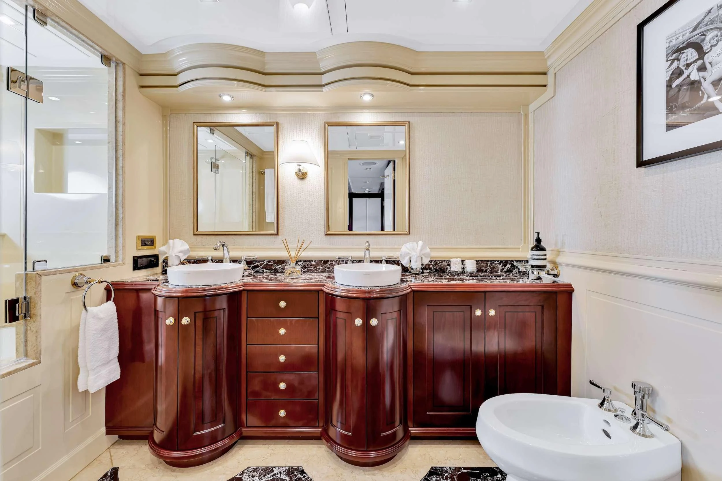 a bathroom with a sink and a mirror aboard SWEET CAROLINE II Yacht for Charter