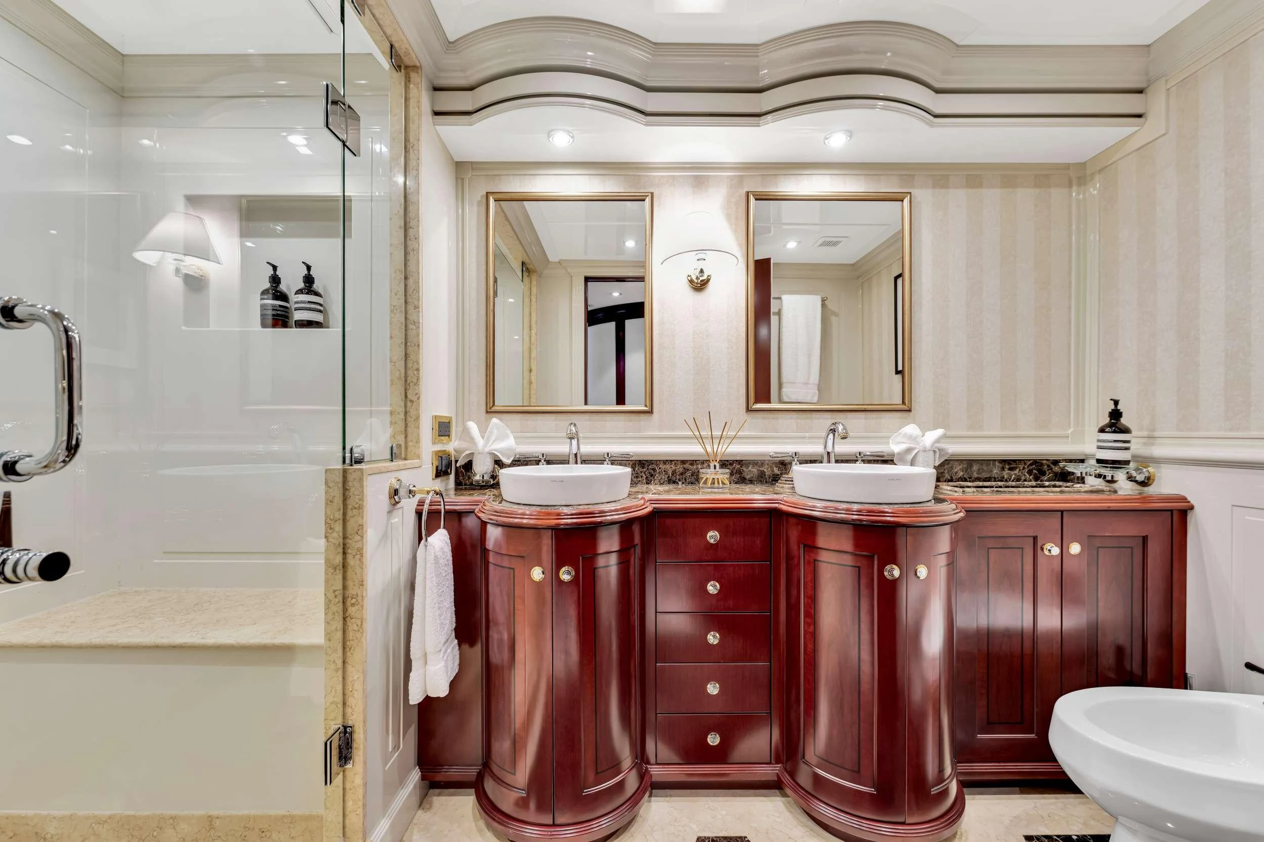 a bathroom with red cabinets aboard SWEET CAROLINE II Yacht for Charter