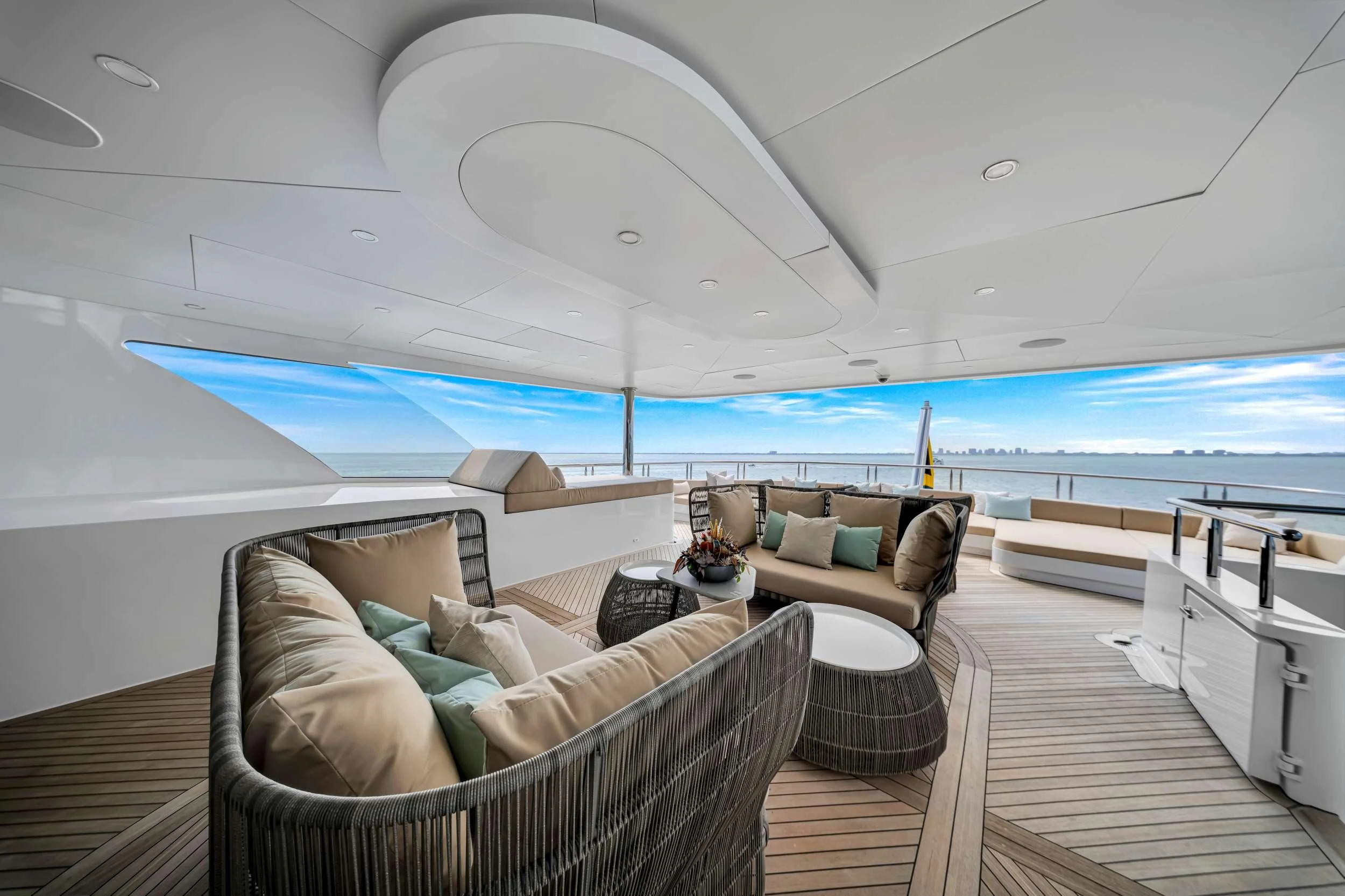 a room with a view of the ocean and the deck aboard SWEET CAROLINE II Yacht for Charter