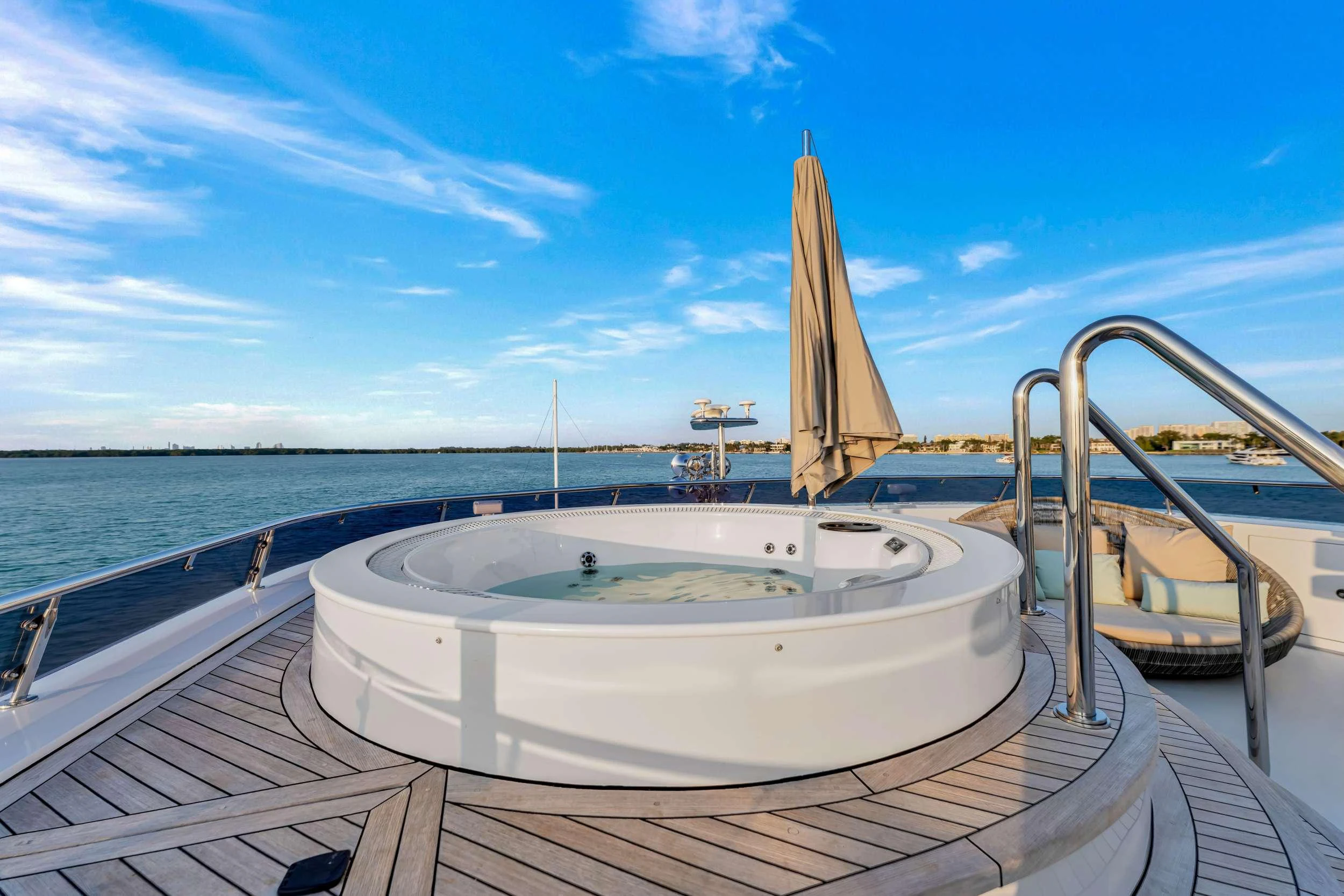 a pool with a large white round object in it by a large body of water aboard SWEET CAROLINE II Yacht for Charter